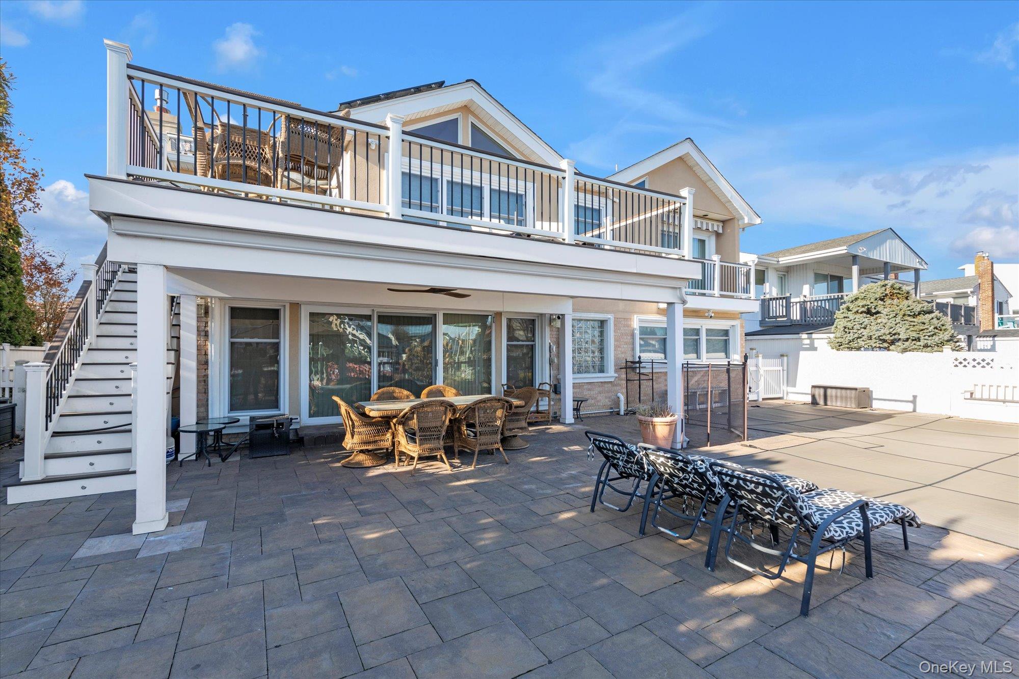 Panoramic Mouth of Bay WATERFRONT Wide-Line Hi-Ranch EXTENDED Upper & Lower Levels!   5BR/3BTH BI-LEVEL!  Seller States New Raised Bulkhead w/New Poles--New Boat Lift--Floating Dock & Raised Ramps!  Features 1/5 Acre O/S Property--Exterior Lighting--IG Salt Water Heated Pool w/Pavers! Prof. Landscaped w/Front/Side/Rear Sprinklers!  2-Car Garage was Converted--4-Car Drive! Brand NEW EXTENDED Eat in Kitchen/Vaulted Ceiling/Motorized Skylite, w/Peppercorn Cabinetry/Glass Backsplash!  Brand NEW Lite & Brite Tiled Kitchen Floor w/ Kitchen Slider to Trex Deck & Motorized Awning!    Extras Include:  2-Zone CAC, Generator, Radiant Heated Floors, Gas Fireplace, Primary Bedroom Balcony with/ Motorized Awning/Huge Walk in Closet/Cherry Hardwood Floors/Lrg Primary Bath, Lower Level Wet Bar w/ 2 Wine Frig, Replaced Roof & Gutters, New Solar Panels--Not Leased, Security Cameras Front & Rear, ADT Security System, Custom Windows, Wood Bannister and Refinished All Hardwood Floors!  A Boater's Delight!  VACATION ALL YEAR ROUND!