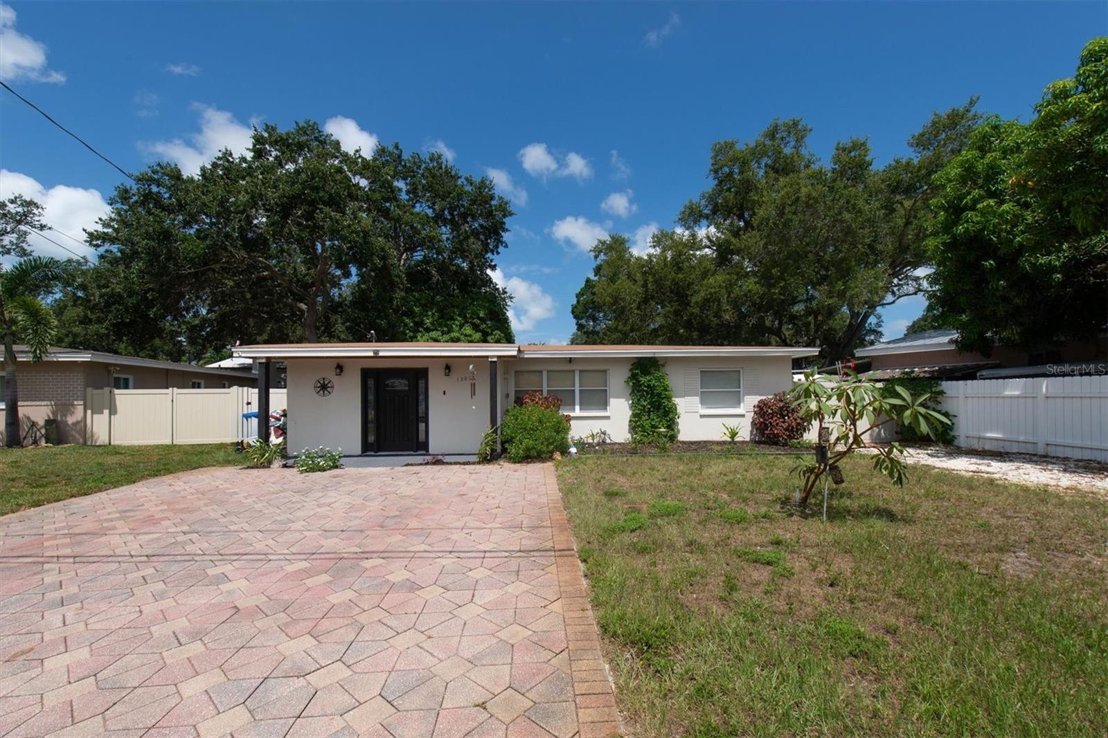 Great Location.  This is one of those homes that you must see in person to see all the possibilities that this home has to offer.  This 4bedroom/2bath home has a most desired layout.  When you enter you will notice a bonus room that can be a formal dining room, Media, Art or even a guest bedroom, the choice is yours.  Then you will walk in the open Living Room with plenty of natural light coming from the large front windows and opens into the oversized kitchen where you will find plenty of cabinet and counterspace.  Off the kitchen is a Full sized Laundry room with plenty of room for extra storage.  In the front of the house there are two spacious bedrooms that share the guest bathroom.  In the back of the house you will find the Primary Bathroom that opens to the Primary Bedroom. The primary bedroom features a walk out to the backyard patio where you will enjoy the view of your own sanctuary. The 4th bedroom is located across the Primary Bathroom.  When you enter the oversized backyard, this is where you will design your own private oasis.  Plenty of room for a pool, garden, games, or anything you can imagine.  The oversized storage shed features electric.  You also have extra parking on the side of the house for a small boat and RV.  Exterior has been freshly painted as well as a new front door.  Short term rentals can be allowed so this is a great opportunity.  NON-EVACUATION ZONE!!! Close to Largo Golf Course and just under 2 miles to Indian Rocks Beach.  Shopping, restaurants, hospitals are all close by.  You must see!!!