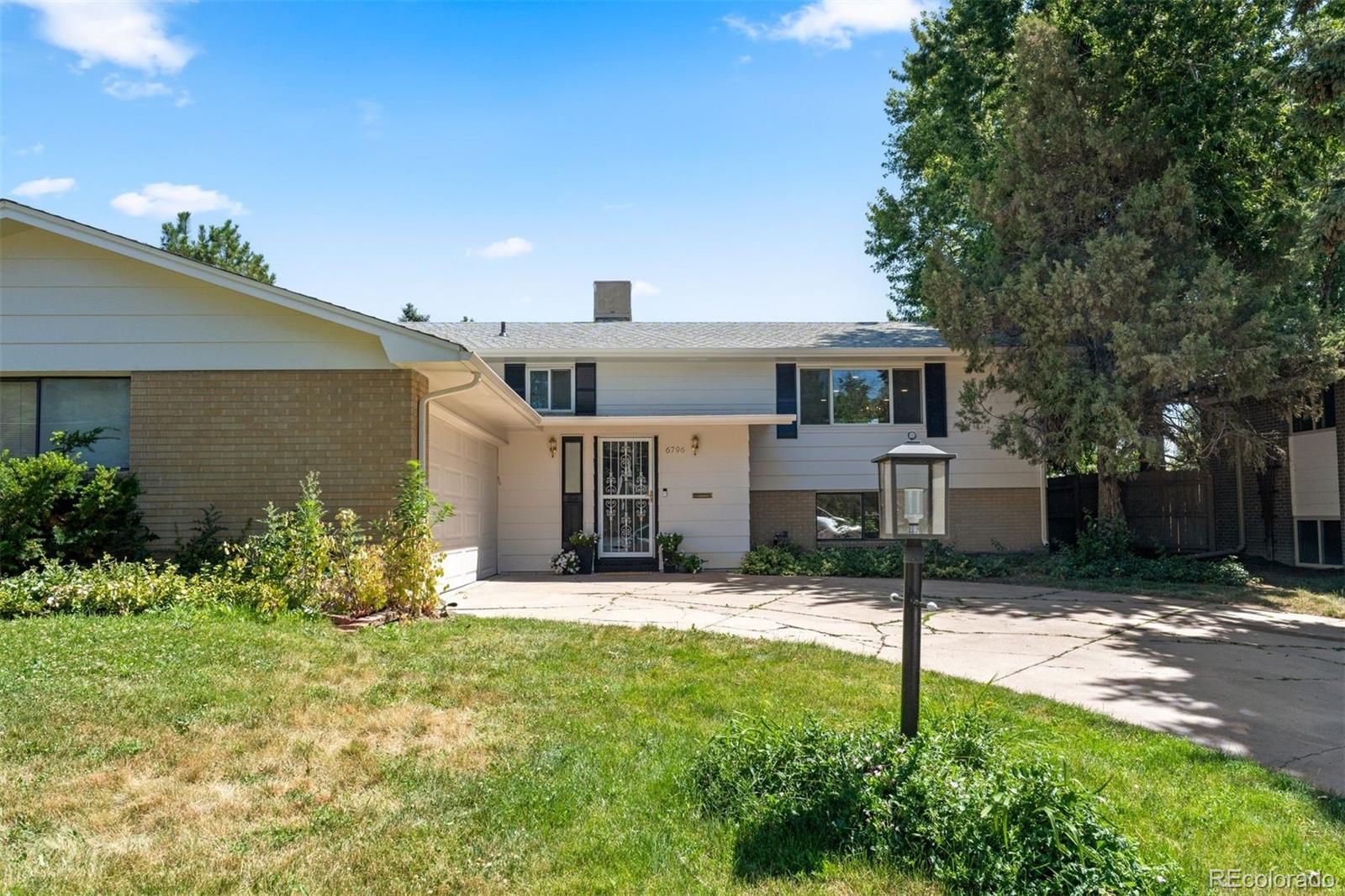 This Winston Downs mid/mod gem is truly one-of-a-kind with 5 bedrooms 3 baths and a separate entrance / walk out in the back.  Uniquely situated on a fabulous block in one of Denver's highly sought after neighborhoods, the home oozes curb appeal with a nice distance on all sides to other homes, a half circle driveway, oversized 2-car garage and picturesque trees that naturally frame the house.  While the home features many updates with a remodeled kitchen, new paint, new carpet and beautiful wood floors, the price provides the ability to continue updating and customizing with style or to enjoy the home as is.  Either way, the value is extraordinary.  The spacious and open layout is an entertainer's dream as the living room flows from the dining room and into the beautiful light filled kitchen that opens to a large back deck. The main level has three bedroom and two baths including an ensuite primary bedroom retreat. Downstairs is a large second living room/rec room with a built in bar area and wood burning fireplace. There are two bedrooms downstairs, one of which is greatly oversized with its own outside entrance. Sound interesting? It sure is! Don't miss the opportunity to buy this extra special home at a wonderful price.