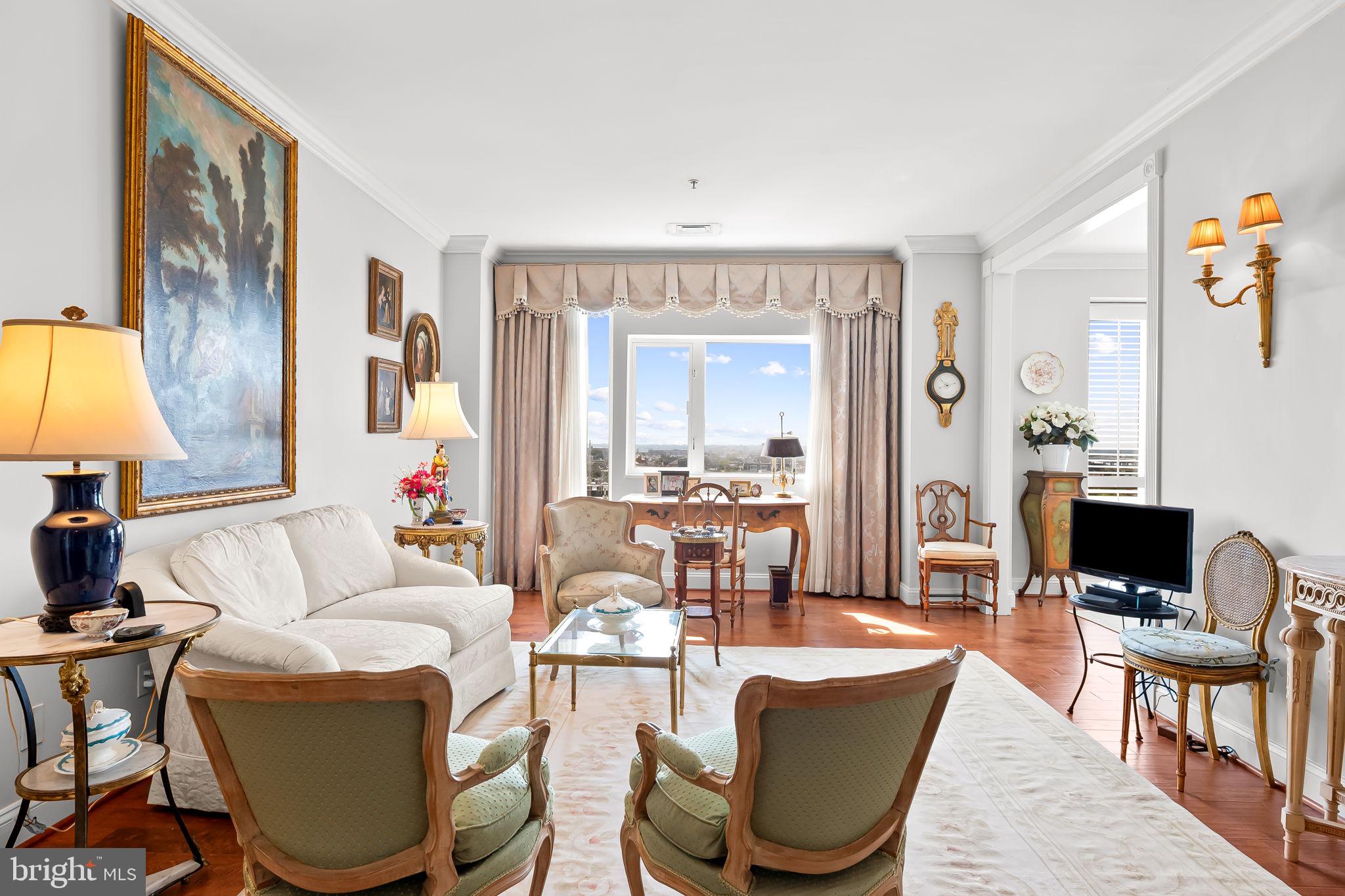 Picture-perfect in the Towers at Harbor Court, Unit 804 was artfully designed with curated spaces reminiscent of a French pied-à-terre. Exquisite architectural enhancements include custom millwork with built-in shelving, elegant crown molding, and beautiful hardwood flooring throughout. The owner’s suite was thoughtfully reimagined to include a versatile second bedroom (approximately 11’ x 6'8"), perfect as a guest room or den. Renovated by Unique Resources, additional upgrades feature a gourmet kitchen with stainless steel appliances, premium granite countertops, and a full-size stackable washer/dryer. Stylish draperies, an exquisite chandelier, and custom plantation shutters convey with the sale—along with a deeded parking space (#46) and a private storage unit.Residents of Harbor Court enjoy premium amenities, including a 24-hour concierge and doorman for ultimate convenience and security, as well as discounted membership to the state-of-the-art Harbor Court Fitness Center featuring an indoor pool, full workout facility, and a wide array of fitness classes. Located just steps from downtown business hubs, the Inner Harbor, Camden Yards, MARC and Amtrak stations, top medical centers (Johns Hopkins and UMMC), and the vibrant shops and dining of Federal Hill, Locust Point, and Cross Street Market, this enchanting apartment is  unlike any other in the building!