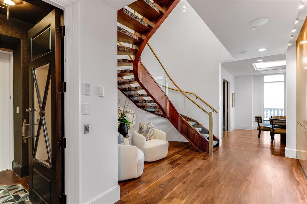 Recently renovated with over 6,600+ SF of luxury urban living! Restricted access elevator opens directly into both levels of this custom, contemporary, two-story penthouse. Beautiful walnut floors, intricately detailed African Sapele Mahogony paneling, four spacious bedrooms, including a large primary suite with terrace and stunning views of downtown. Home features flexible living and entertaining spaces, including a 2,200-bottle wine room. Chef’s kitchen with Calcutta stone countertops, SubZero refrigerator and Wolf commercial gas oven adjoins a large dining room with wet bar. Home conveys with four parking spaces and two storage spaces.