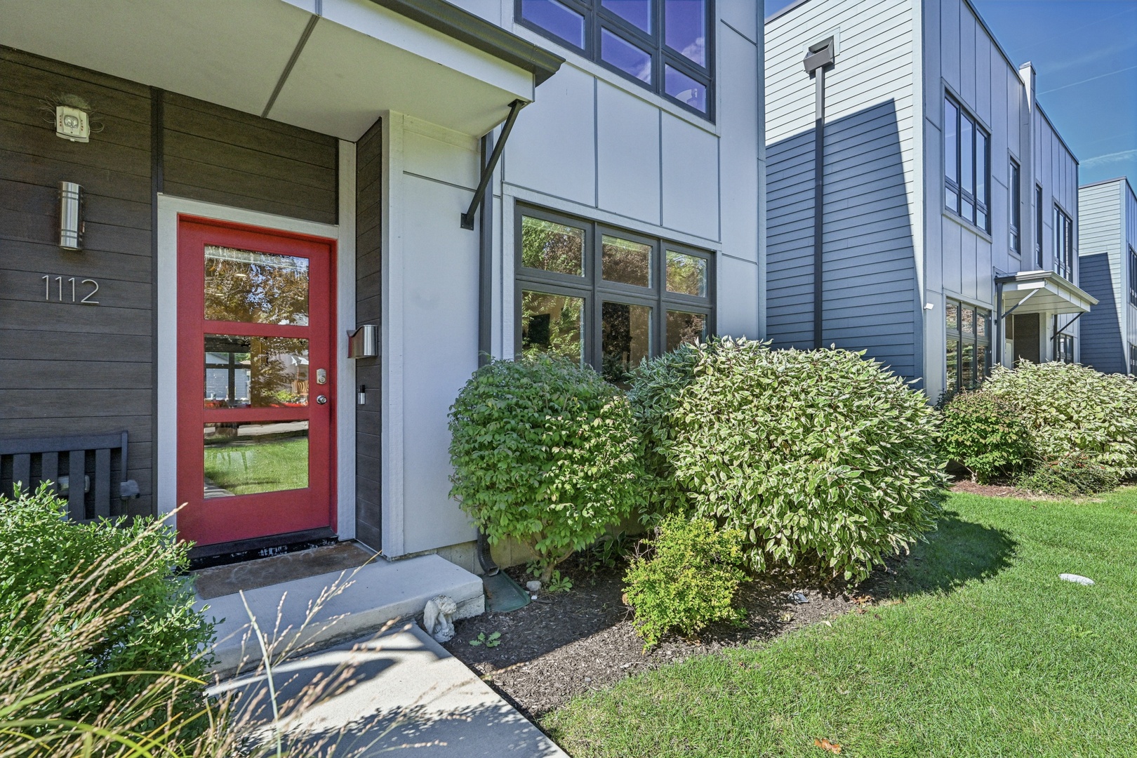 This artist-owned duplex is part of Pitner Row, a modern development completed in 2020 in Evanston's sought-after West Village neighborhood. East-facing and filled with natural light, the home showcases contemporary finishes and hardwood floors throughout. The spacious living and dining area offers an inviting flow for entertaining, while a sleek hallway includes a chic powder room and an oversized, customizable pantry. The all-white kitchen features stainless steel appliances, a deep farmhouse sink, quartz countertops, and a large island with seating that opens to a bright breakfast room. A sunny family room with a gas fireplace overlooks the private backyard, and a generous mudroom provides additional storage or room for a second pantry. Hunter Douglas PowerView blinds with remote in the living room and primary bedroom. The second floor includes a serene primary suite with a 14' x 6' walk-in closet and a spa-like ensuite bath with a double vanity, soaking tub, and separate shower. Additionally on this level, you'll find three bedrooms, a full hall bath, a convenient laundry closet and mechanicals.  Enjoy the extra-deep backyard with two patios-perfect for outdoor dining and entertaining-enclosed by a six-foot privacy fence and complemented by a two-car garage with pull down stairs to storage. Ideally located near the new Robert Crown Center, Herbert Park, the North Shore Channel Trail, and the Evanston Ecology Center, and close to transportation, shops, and restaurants.