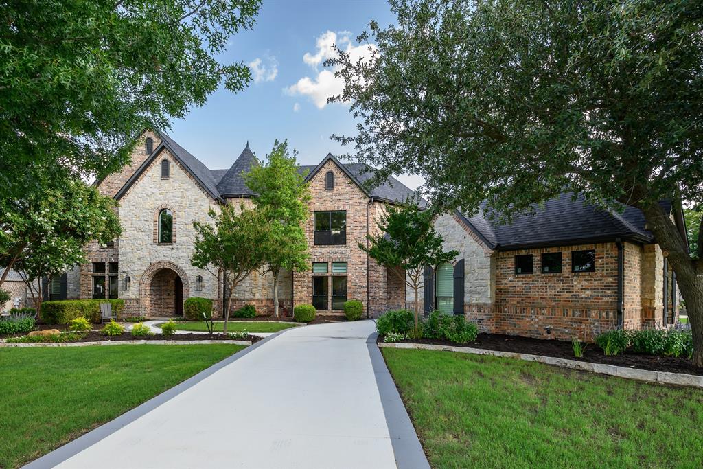 This stunning 5,810 Sq. Ft. custom estate in the prestigious Whispering Farms neighborhood blends modern luxury with spacious comfort on 1.65 acres. The open layout features expansive windows, flooding the home with natural light. The gourmet kitchen, equipped with Sub Zero and Thermador appliances, is perfect for entertaining. The master suite offers a spa-like retreat with a soaking tub and double-entry shower. Upstairs, enjoy a game room, 3 spacious bedrooms, and en-suite bathrooms. The media room, study, and home gym add versatility. Outdoors, experience resort-style living with a pool, fire features, putting green, and outdoor kitchen with a grill and fridge. The 4-car garage and ample storage complete this dream property, offering both privacy and luxury just steps from your backyard paradise.