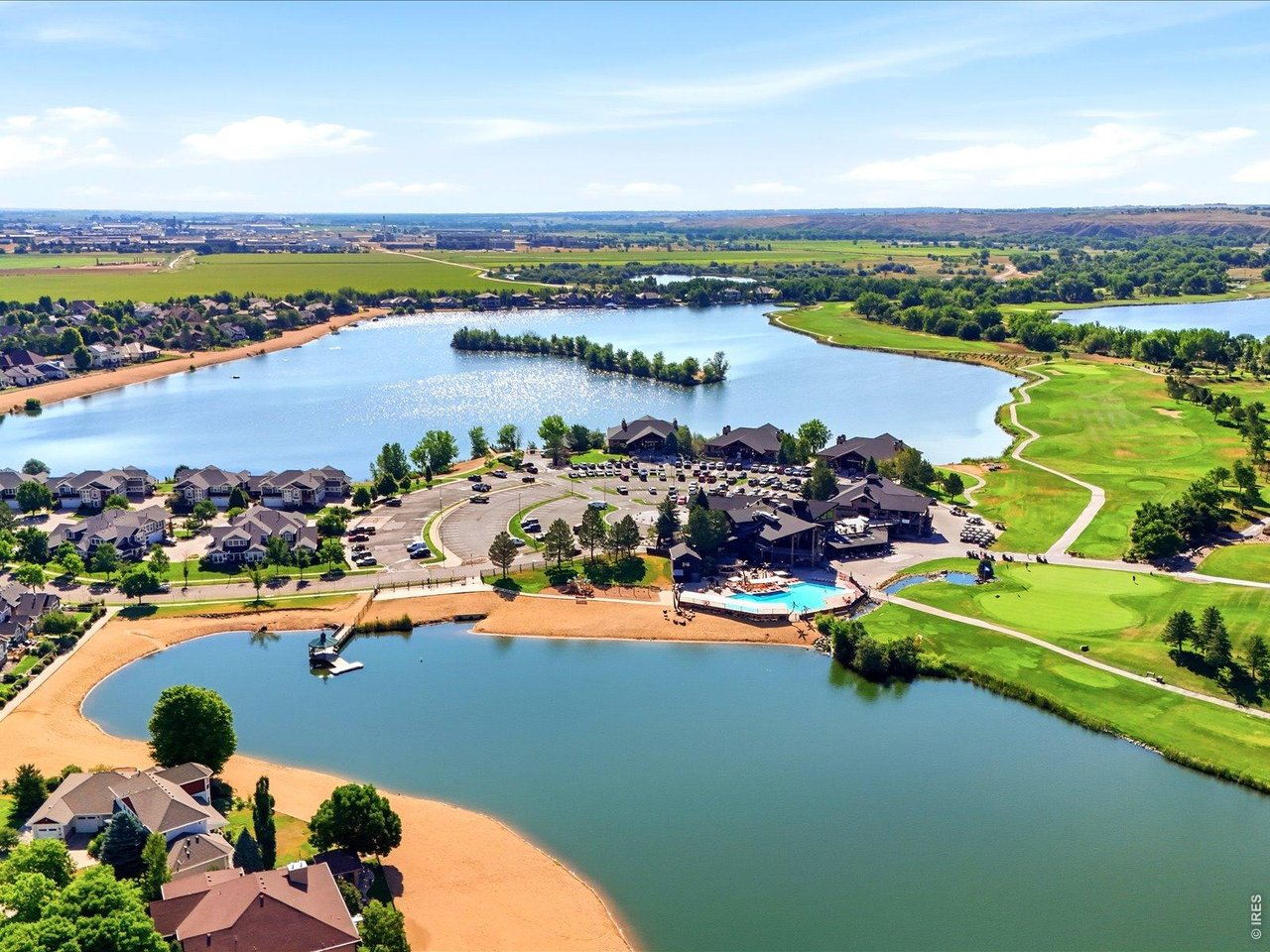 Welcome to Water Valley! This exceptional custom home enjoys a prime location just steps from Rock Bridge Lake and a short walk or golf cart ride to Pelican Lakes Golf Course, the Pelican Lakes Country Club pool, The Lodge, and The Sandbar. Built with quality craftsmanship, it offers a rare combination of luxury finishes, generous square footage, and exceptional value. The open-concept main level is anchored by a gas fireplace and flows into a kitchen featuring custom cabinetry, granite countertops, a large island, Viking range with built-in griddle, and walk-in pantry. An impressive 11.5-foot glass door opens to a screened porch and adjoining patio, where natural boulder accents create a year-round retreat. A flexible main-floor bedroom is ideal for an office, guests, or anyone seeking the convenience of main-floor living.Upstairs, the primary suite offers a spa-inspired bath with a dual-head shower and soaker tub, plus a 150 sq. ft. walk-in closet that serves as a dressing retreat with exceptional storage and convenient access to the laundry room from both the primary closet and hallway. Two additional bedrooms and a loft with a private bath provide flexible space for living, guests, work, fitness, or play.The finished basement features a recreation room with an included home theater, perfect for movie nights and game days. The oversized 3-bay, 4-car garage accommodates cars, a golf cart, bikes, paddleboards, kayaks, and gear for Colorado living. Enjoy four community lakes, private beaches, golf, pickleball, tennis, trails, boating, fishing, Eastman Park, resident farms and orchards, or even float the Poudre River. Nearby Hoedown Hill offers skiing, snowboarding, sledding, dining, concerts at The Grain Bin, and sand volleyball. The W Club Fitness Center and Raindance River Resort complete an exceptional lifestyle where recreation, dining, and conveniences come together just moments from home.