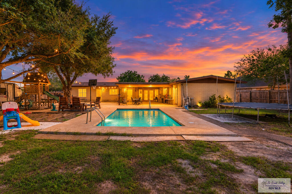 Resaca Frontage!!Enjoy the charm of ranch-style living in this inviting home ideally situated along the resaca. Featuring 4 Bedrooms,2.5 Baths, open floor plan, an abundance of storage.  The exterior features a sparkling swimming pool, oversized covered patio and a large, spacious lot, this property offers plenty of room to relax, entertain, and enjoy the outdoors. Conveniently located just minutes from schools, shopping, the hospital, and the expressway, this home combines a desirable waterfront setting with the convenience of being close to everything. A wonderful opportunity to enjoy comfortable living, generous outdoor space, and a prime central location!