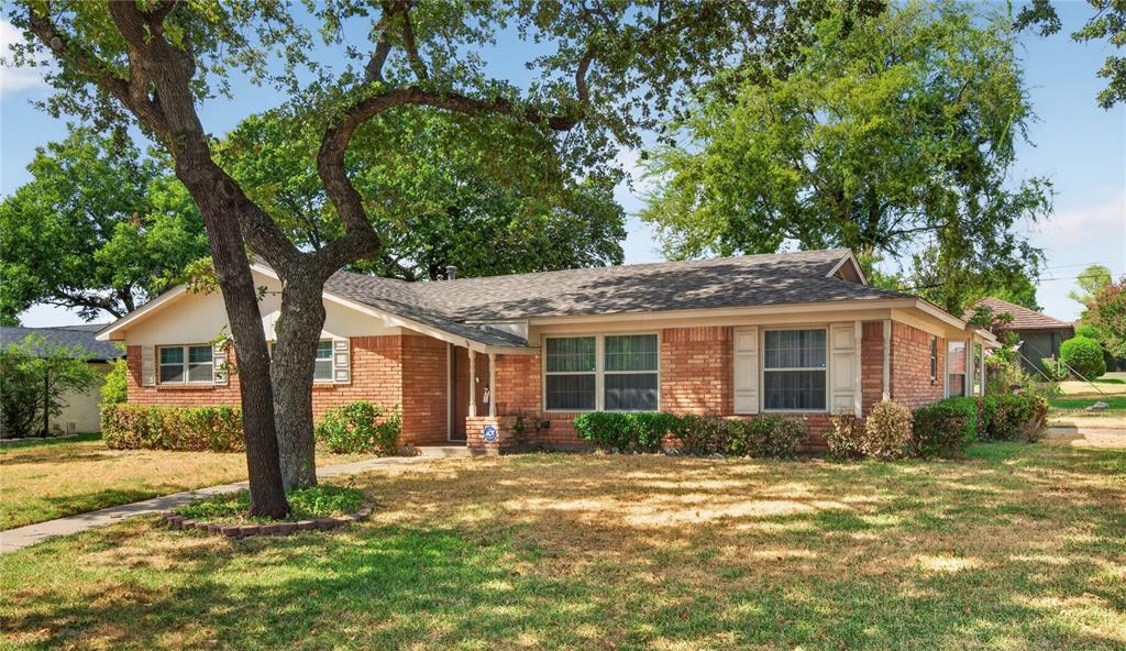 If you love homes with character, craftsmanship and authentic mid-century style, this one may steal your  heart!  Beautifully maintained through the years, this home is what made this era so special.  The classic living & formal dining combination gives you plenty of room to relax, visit with friends, or gather around the table for a meal without feeling crowded.  It's a comfortable, flexible, space that works for everyday living, as well as it does for holidays and special occasions.  The kitchen has the traditional galley-style layout with an glass top electric range, built in dishwasher and microwave, along with a separate breakfast nook for daily meals.  The den is a show-stopper with gorgeous wood paneled walls (NOT the fake stuff!), built in shelving, and a brick, wood-burning fireplace.  There is also a huge bar area that was made for entertaining!  This custom built bar is complete with a large bar top, mirror with glass shelves, a wine fridge, and great storage for all of your glassware and bottles.  There's also a small conversational sitting area that is perfect for quieter discussions or just a place to relax.  The primary bedroom includes a custom closet area that separates the bedroom from a large, bonus room that could be used as an office, workout room, nursery, hobby room, or whatever works best for you.  The primary bath has been updated with a walk in shower.  And THEN there is the backyard!  It is the perfect hangout if you enjoy gardening, flowers, or just like spending time outside.  Enjoy the patio, gazebo, numerous flower beds & planting areas, a greenhouse for herbs & bulbs, and a storage shed.  This location is hard to beat - right in the heart of DFW with easy access into either city, DFW airport, restaurants & shopping.  If you value the beauty of classic designs & vintage features of this style of older homes, come and check it out!  This ain't your regular cookie-cutter home; it is one-of-a-kind, with a personality all its own!