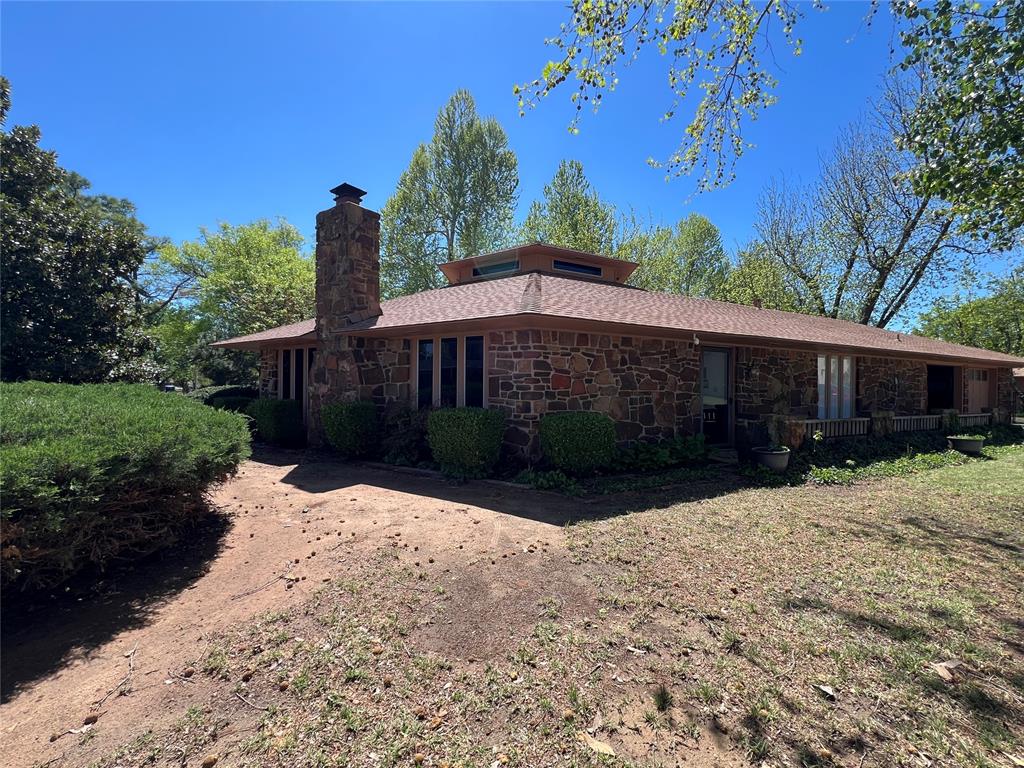 One of a kind rock home tucked away in a quiet neighborhood. Large lot with serene, beautifully maintained yard. There is an over sized single car garage & workshop with AC and Storage Shed.  This 3-bedroom home with bonus room (could be an 4th bedroom) and office offers a well designed space featuring  an open concept living/dining with fireplace centered around the heart of the home, the kitchen! The kitchen is a must have with tons of cabinets, island, large enough space for that industrial fridge you always wanted-Updated countertops. Immaculately maintained and move-in ready, this home reflects pride of ownership throughout with thoughtful updates and timeless charm. Enjoy peaceful evenings by the backyard water feature/pond and experience the warmth and character that makes this home truely special.  Select furnishings available. Some items reserved.