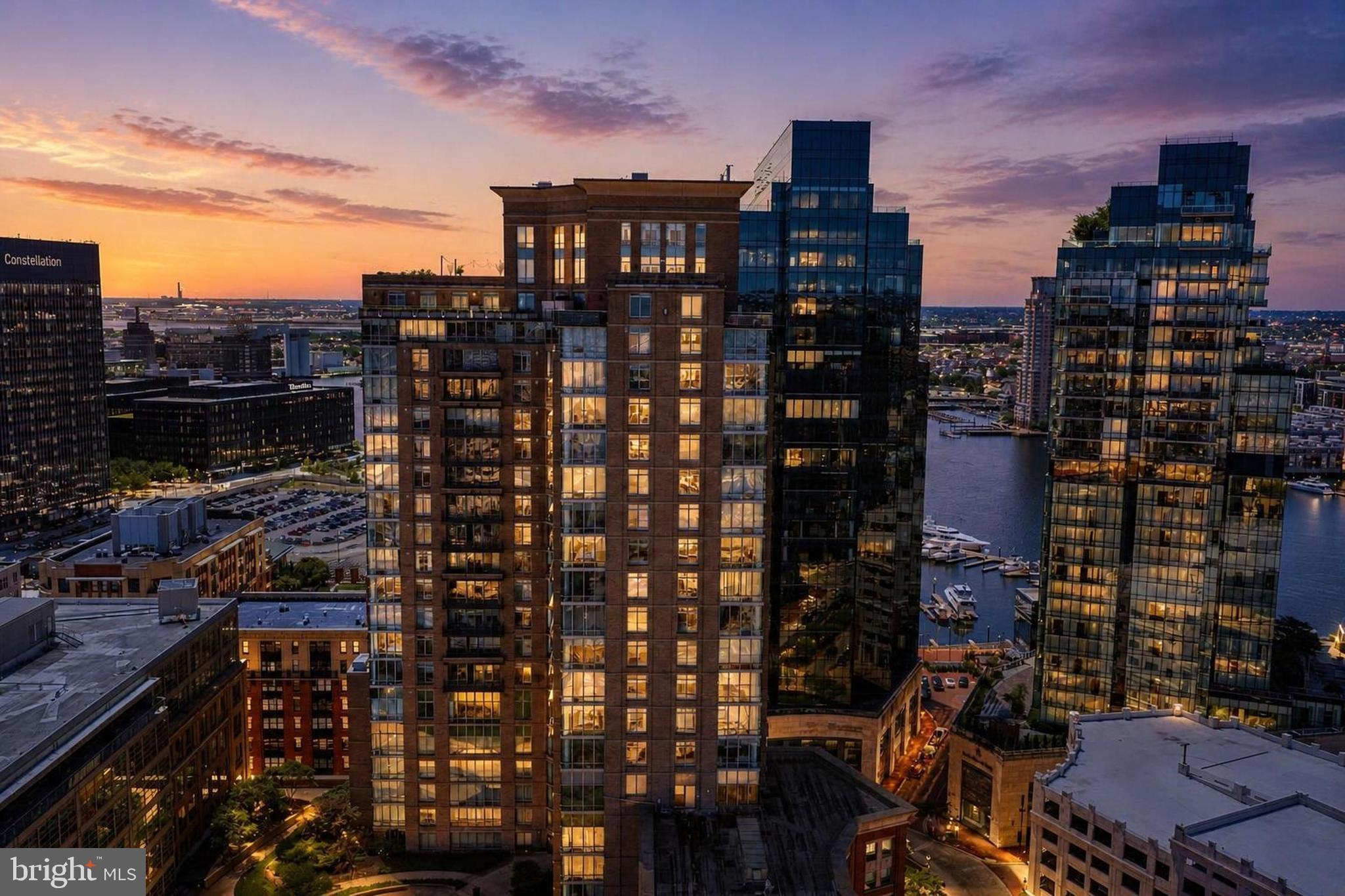**Sellers are offering to pay up to $10,000 towards the buyer's closing costs**Experience upscale Harbor East living in this beautifully updated 2-bedroom, 2-bath condo on the 15th floor of The Vue. This light-filled residence features brand-new flooring, updated bathroom, and elegant marble countertops that elevate the kitchen and living spaces. Enjoy stunning city views from your private balcony—perfect for morning coffee or evening sunsets.This unit includes one dedicated parking space, with the option to purchase an additional space. The Vue offers direct access to the secure, attached parking garage for everyday convenience.Residents of The Vue enjoy full-service amenities, including concierge service, 24-hour security, and on-site management. Condo fees cover heat, air conditioning, hot water, water, sewer, front desk staff, package acceptance, and building maintenance, providing exceptional value and peace of mind.Within the building is Coppermine Health & Fitness, featuring indoor heated pools, squash courts, and state-of-the-art training facilities. An outdoor dog park is located on the 8th level, making this a pet-friendly urban retreat.Located in the heart of Harbor East - one of Baltimore’s most walkable neighborhoods - you’re steps from Baltimore’s best restaurants, boutique shops, Whole Foods, Starbucks, the waterfront, nightlife, and the on-site Harbor East movie theater. This is luxury city living at its most convenient.  Make your appointment today!