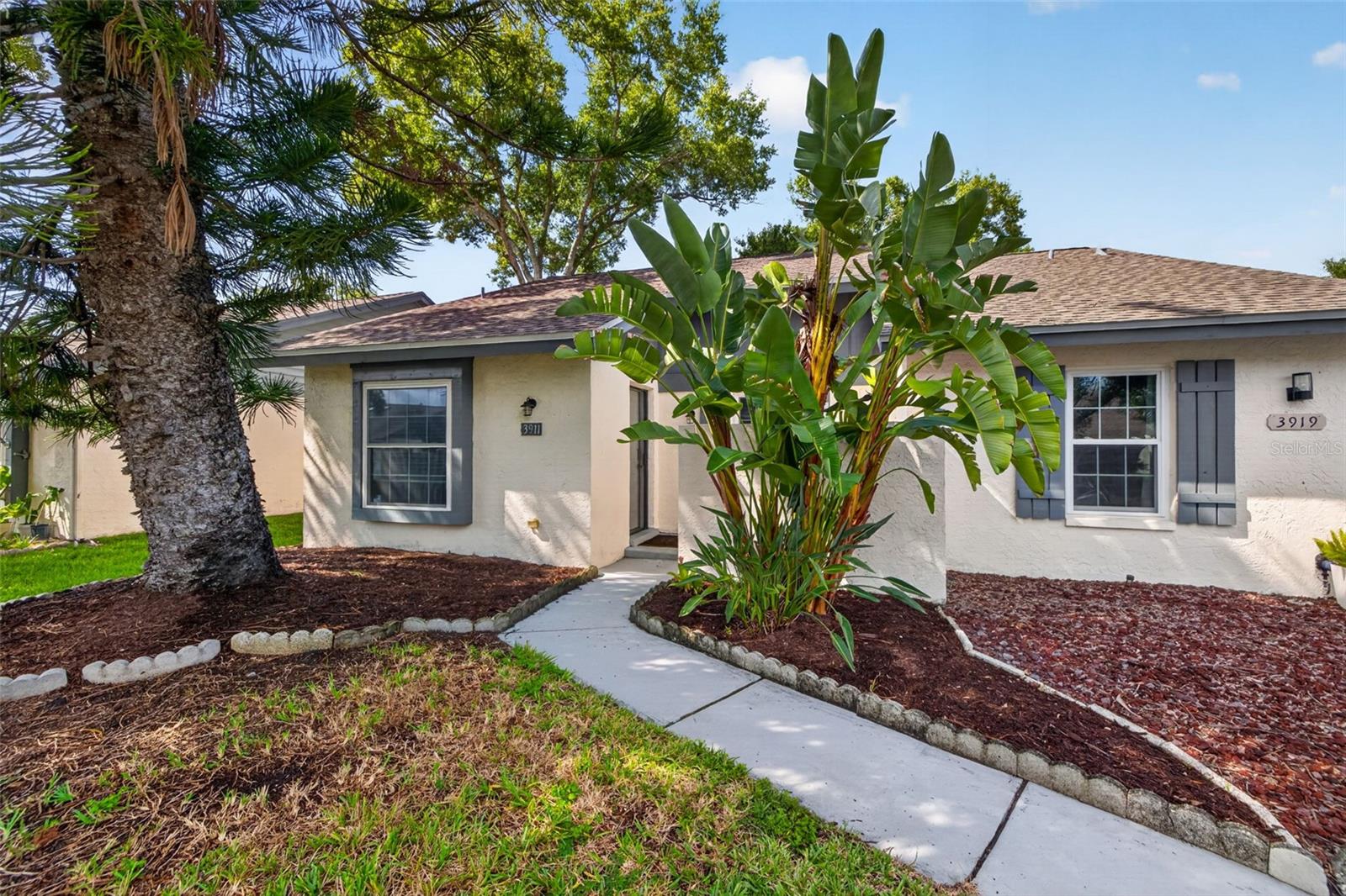 Welcome home to this beautifully updated 3-bedroom, 2-bathroom end-unit villa with a sunroom in the desirable Belle Oak Villas community of Largo! Offering the added privacy and abundant natural light that comes with an END UNIT, this home combines an inviting OPEN FLOOR PLAN with thoughtful updates and a convenient Pinellas County location.Inside, you'll find soaring cathedral ceilings, an open living and dining area, and a well-appointed kitchen featuring granite countertops, solid wood cabinetry, and stainless steel appliances. The home also features IMPACT RATED WINDOWS with, a 2019 Trane HVAC system, and a convenient INTERIOR LAUNDRY ROOM for washer and dryer.Major improvements continue outside, including a NEW ROOF INSTALLED 2023 and new landscaping, giving the home excellent curb appeal and added peace of mind. The fenced-in rear lanai and private courtyard area provide a comfortable space to relax, entertain, or enjoy the Florida lifestyle.Belle Oak Villas is a well-maintained, high-and-dry community that DOES NOT REQUIRE FLOOD INSURANCE and offers beautiful lakes, two community pools, and a welcoming atmosphere for residents of all ages. The community is also large-pet friendly, making it an excellent option for a variety of lifestyles. The HOA is just $88 a month, providing an attractive combination of affordability and community amenities.Centrally located in Largo, you're just minutes from grocery stores, shopping, restaurants, and everyday conveniences, with Indian Rocks Beach approximately 15 minutes away, St. Pete-Clearwater International Airport about 15 minutes away, and Tampa International Airport approximately 30 minutes away.End-unit villas with this combination of space, updates, and location are rarely available in Belle Oak Villas. Come see why this one deserves a spot at the top of your list!