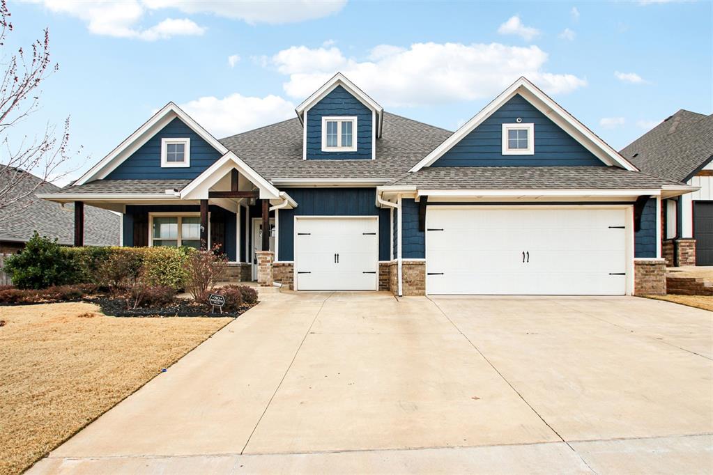 Fall in love with this head-turning Craftsman charmer in the heart of The Grove! With 4 bedrooms, 3 full baths, and a versatile bonus room, this 1.5-story home blends smart design with serious personality. From the moment you walk in, you’re greeted by soaring coffered ceilings, rich wood-look tile flooring, and a statement stone fireplace that anchors the living space. A sleek barn door adds style and separation between living and sleeping quarters,  perfect for privacy or play.Calling all kitchen lovers, this one’s a total showstopper! The oversized island, quartz countertops, built-in stainless steel appliances, and full-height cabinetry make it both gorgeous and functional. Plus, the farmhouse sink and designer backsplash give it just the right touch of farmhouse flair.The dreamy primary suite is your personal sanctuary, complete with ambient ceiling lighting, two walk-in closets, dual vanities with granite countertops, a jetted soaking tub, and a spa-like walk-in shower. It’s a space you’ll actually look forward to ending your day in.Love to entertain? The backyard delivers with a large covered patio, built-in brick fireplace, and plenty of room to relax, gather, or throw an impromptu game night. And don’t miss the 3-car garage with in-floor storm shelter for added peace of mind.With smart home features, water softener system, a Rinnai tankless water heater, air purification system, R-44 insulation, and solarboards, this home is as efficient as it is stylish.Tucked inside the vibrant Grove community, you’ll enjoy two clubhouses, resort-style pools, fitness centers, stocked fishing ponds, playgrounds, scenic trails, and even an on-site elementary school. Whether you’re upsizing, rightsizing, or just ready for something special, this home checks all the boxes.