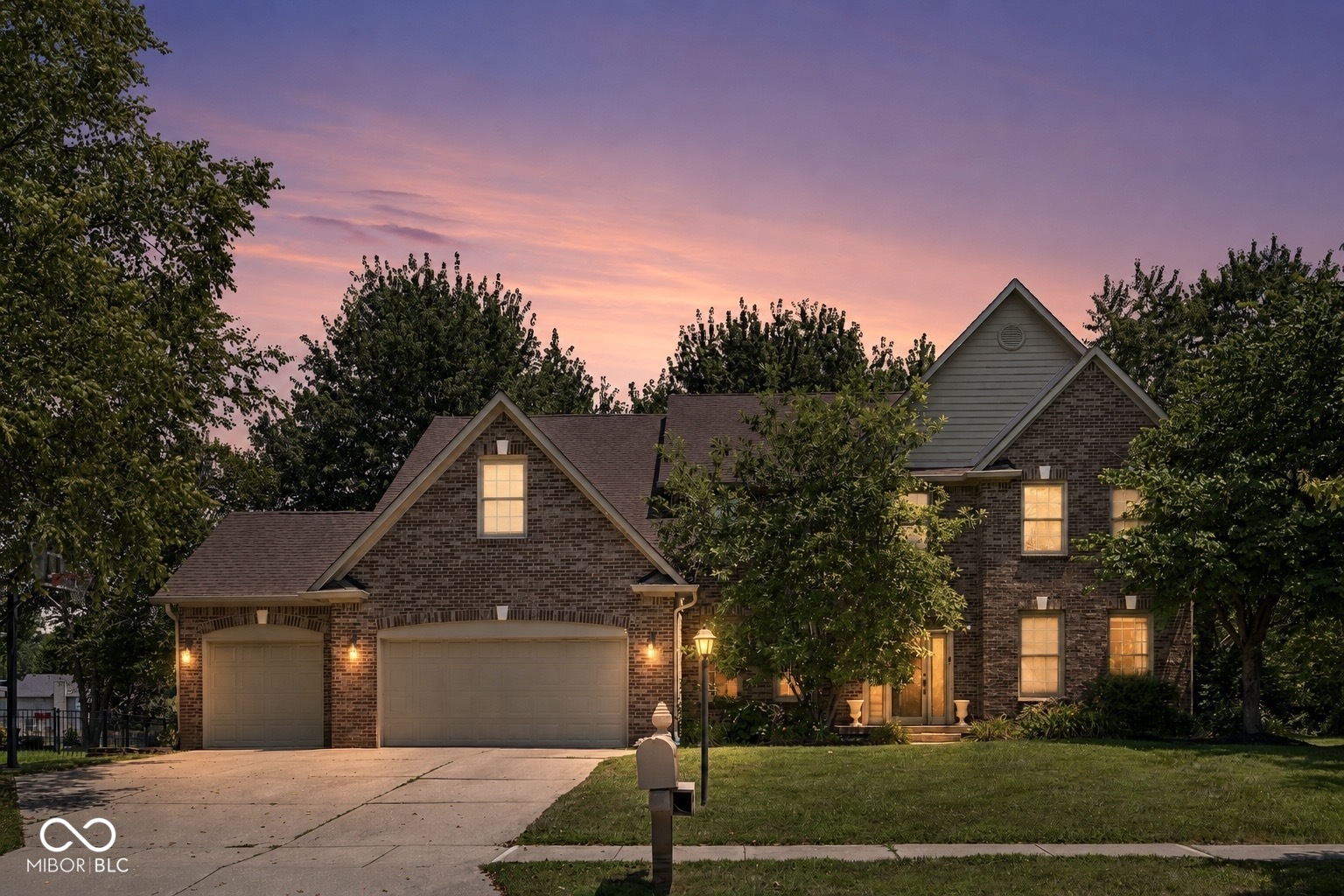 Welcome to this beautiful custom home in the highly sought-after Woods Edge at Windermere community in Fishers! Offering over 4,500 sq ft of finished living space, this 4 bed/3.5 bath residence (w/ full finished basement!) combines timeless design with thoughtful updates and exceptional indoor-outdoor living. Stunning two-story living room feat. a gas fireplace, custom built-ins, and abundant natural light and view of the mature trees. The spacious kitchen is designed for everyday living and entertaining w/ granite countertops, generous cabinetry, a breakfast nook eating area, and an open flow into the main living spaces. Gorgeous hardwood floors throughout rooms on the main level, as well as crown molding throughout. The main-level office and bonus room provide flexible spaces for working from home, hobbies, play, or hosting. The finished basement expands the home's versatility with a dedicated home theater, kitchenette, and additional gathering space-ideal for movie nights, game days, or entertaining guests. Upstairs you have all the bedrooms- including an incredibly spacious primary bedroom and en suite with dual sink vanity and an expansive walk-in closet. Outside, enjoy summer evenings on the expansive brick paver patio overlooking a scenic neighborhood pond, or relax around the firepit. Mature, professionally maintained landscaping and established trees create a backyard oasis. Spacious 3-car garage! New water heater and updated interior painting. Take advantage of the neighborhood amenities such as the park/playground, tennis and basketball courts, and an optional POOL membership! Great location- conveniently located close to Geist Reservoir, parks, IKEA, TopGolf, tons of shopping and dining in downtown Fishers and the Nickel Plate District, and provides easy access to I-69 for easy commutes.  Also within the award-winning Hamilton Southeastern School district. Hurry- very few homes come up for sale in Woods Edge at Windermere & when they do, they sell fast!!