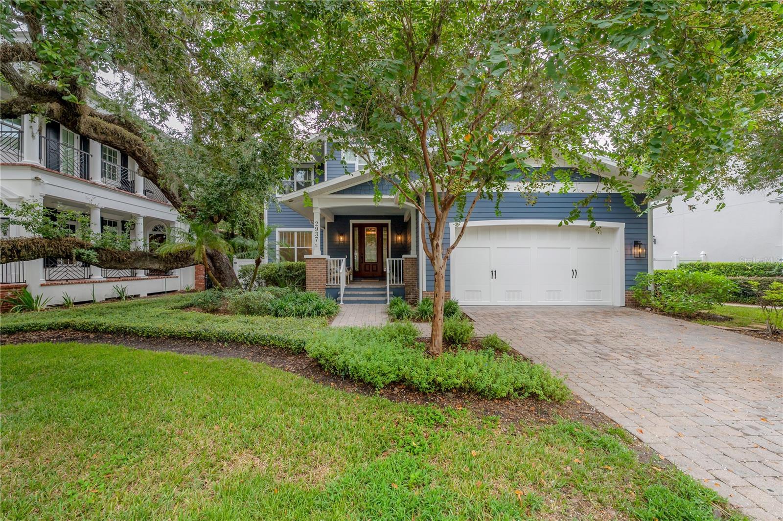 This Craftsman-style gem sits gracefully on one of the most picturesque streets in Bayshore Beautiful. A custom Javic construction build, this home balances everyday comfort with refined sophistication.
A welcoming front porch invites you inside, where you’ll find soaring ceilings, freshly painted interiors, crown molding, and rich engineered hardwood floors. To the left, natural light floods the formal dining room — an elegant space for entertaining. To the right, a custom dry bar leads to the expansive kitchen, where abundant cabinetry, a large walk-in pantry, stainless steel appliances, wine fridge, and gas cooktop cater to every culinary need. A generous island anchors the space, perfect for gatherings, while the open layout flows seamlessly into the dining area and out to the backyard oasis. The screened lanai is an entertainer’s dream, featuring a heated saltwater pool and spa, lush tropical landscaping, and low-maintenance turf that make it both private and practical.

Back inside, the spacious family room with custom built-ins offers a comfortable retreat. Upstairs, the primary suite is joined by three additional bedrooms, two connected by a Jack and Jill bath, and one with its own en suite. In addition to the bedrooms there is an office space. Just a short stroll to iconic Bayshore Boulevard and minutes from downtown Tampa, this home delivers the perfect blend of style, functionality, and location.