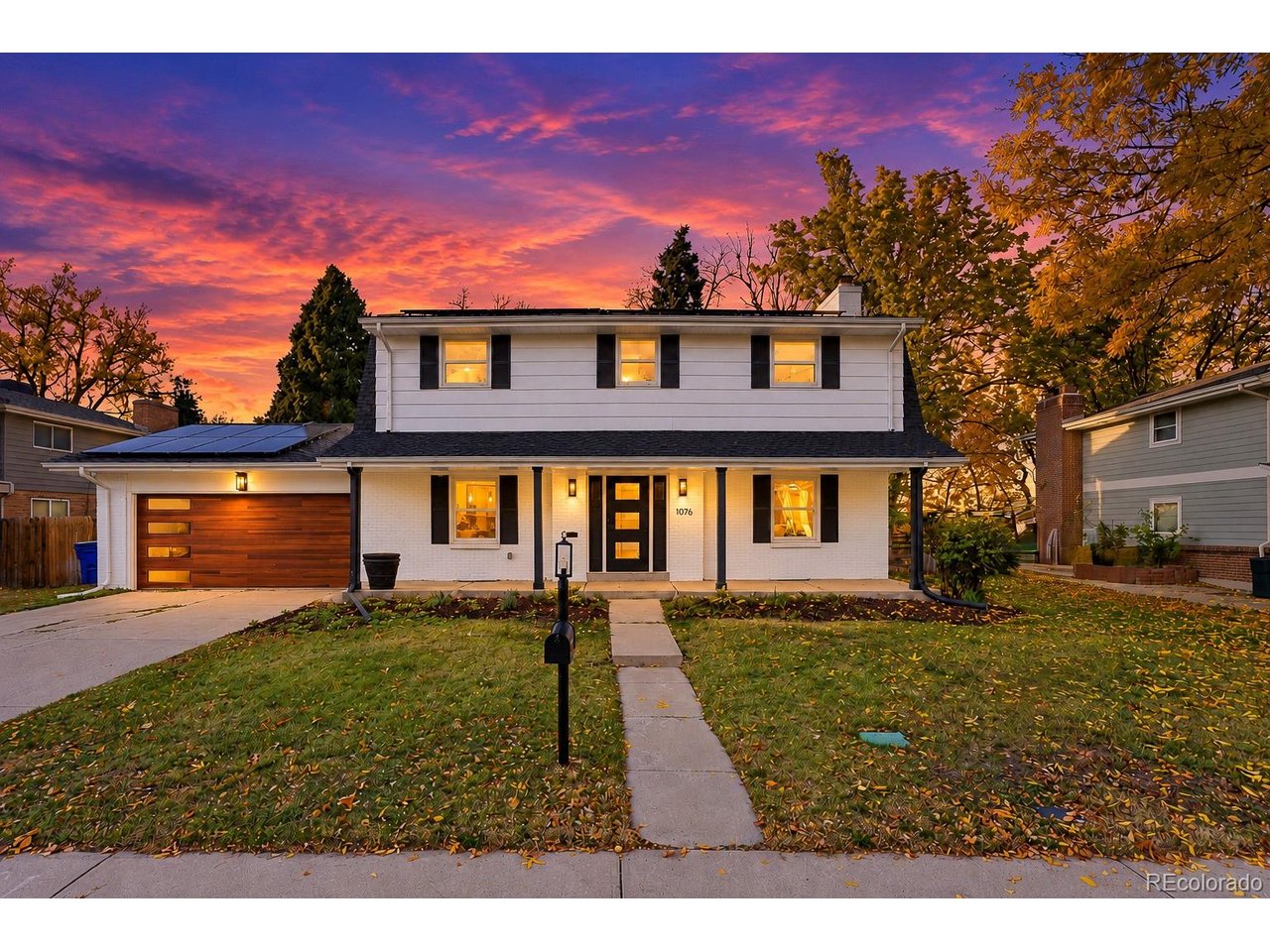 Welcome to 1375 W. Hinsdale Drive, where modern elegance meets timeless charm! From the moment you arrive, you'll appreciate the freshly painted white exterior, striking modern front entry, and beautiful wood-tone garage door with contemporary glass accents. Step inside to discover a bright, open floor plan featuring gorgeous hardwood flooring, fresh neutral finishes, recessed lighting, and thoughtfully selected design details throughout.The heart of the home is the beautifully updated kitchen, featuring crisp white cabinetry, sleek countertops, stainless steel appliances, stylish pendant lighting, and a spacious center island perfect for entertaining. The kitchen flows effortlessly into the dining and living areas, creating an inviting space for everyday living and gatherings. The spacious living room features a stunning statement fireplace with a modern floor-to-ceiling accent wall, adding warmth and character to the home.Upstairs, the impressive primary suite offers a relaxing retreat, complete with a beautifully remodeled five-piece bathroom featuring a freestanding soaking tub, spacious walk-in shower with designer tile accents, dual vanities, and elegant modern fixtures. Additional bedrooms provide generous living space, while thoughtful touches such as custom shelving, modern barn-style doors, and updated bathrooms elevate the home's overall design.The finished basement adds even more versatility, featuring additional bedrooms, a spacious secondary living area, an updated three-quarter bathroom, and a separate laundry space. With **two laundry areas-one upstairs and one in the basement-** this home offers exceptional everyday convenience and flexibility.Combining sophisticated finishes, multiple living areas, five bedrooms, four bathrooms, and an incredible location in Littleton, this beautifully remodeled home is ready for its next chapter.