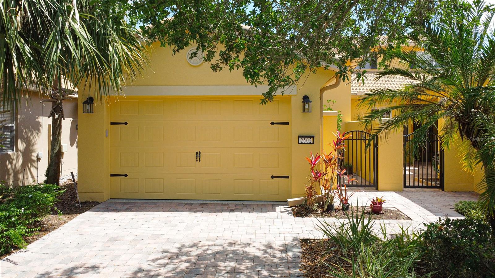 You must see this move in ready home to appreciate this 2 bedroom 2 bath plus a den Cortina Model.  Fully furnished except for personal items left in closets.  It sits on the 9th hole of the Oaks golf course and also has a water view.  You can sit and watch the golfers from your lanai during the day and then sip cocktails in the evening while you watch the abundant wildlife.  upgraded carpet in Den and Guest Bedroom. Vinyl Plank waterproof flooring was added in Great room, Dining Room and Primary Bedroom.  The Master bedroom and bath includes a walk-in closet, a walk-in shower 2 sinks, Corian counter tops and cherry cabinets.  The Kitchen includes Corian counters Cherry Cabinets with pull out drawers in the bottom cabinets, stainless steel appliances, a new microwave oven and a newly replaced garbage disposal.  The washer and dryer are like new.  The Air Conditioning was replaced in 2021 with a Lennox system.  The water heater was replaced in 2024.  The Garage floors were polyurethane coated in 2024.  The garage door opener was replaced in 2024 and to top it off, the Sliding Glass door to the Lanai was replaced with an Anderson Sliding door in 2024.