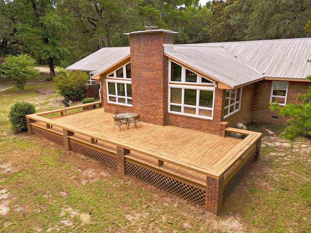 Escape to the serenity of lakefront living with this beautiful 3-bedroom, 3-bath home nestled on approximately 3 private acres in Grady County, Georgia. Offering breathtaking water views and direct waterfront access, this property combines peaceful country living with the perfect setting for recreation and relaxation.  Inside, you'll find a spacious and inviting floor plan featuring comfortable living areas, a well-appointed kitchen, and generously sized bedrooms, including a primary suite designed for comfort and privacy. The home also offers a whole home generator.  Large windows throughout the home capture stunning lake views and fill the interior with natural light.  Step outside to enjoy the expansive acreage, providing plenty of room for outdoor activities, gardening, or simply soaking in the tranquil surroundings. Whether you're fishing from the shoreline, enjoying morning coffee overlooking the water, or entertaining family and friends, this property offers endless opportunities to enjoy the lake lifestyle.  A rare opportunity to own a private waterfront retreat with acreage, this exceptional property delivers the perfect blend of space, scenery, and Southern charm. Schedule your private showing today and discover all that this Grady County lakefront gem has to offer.