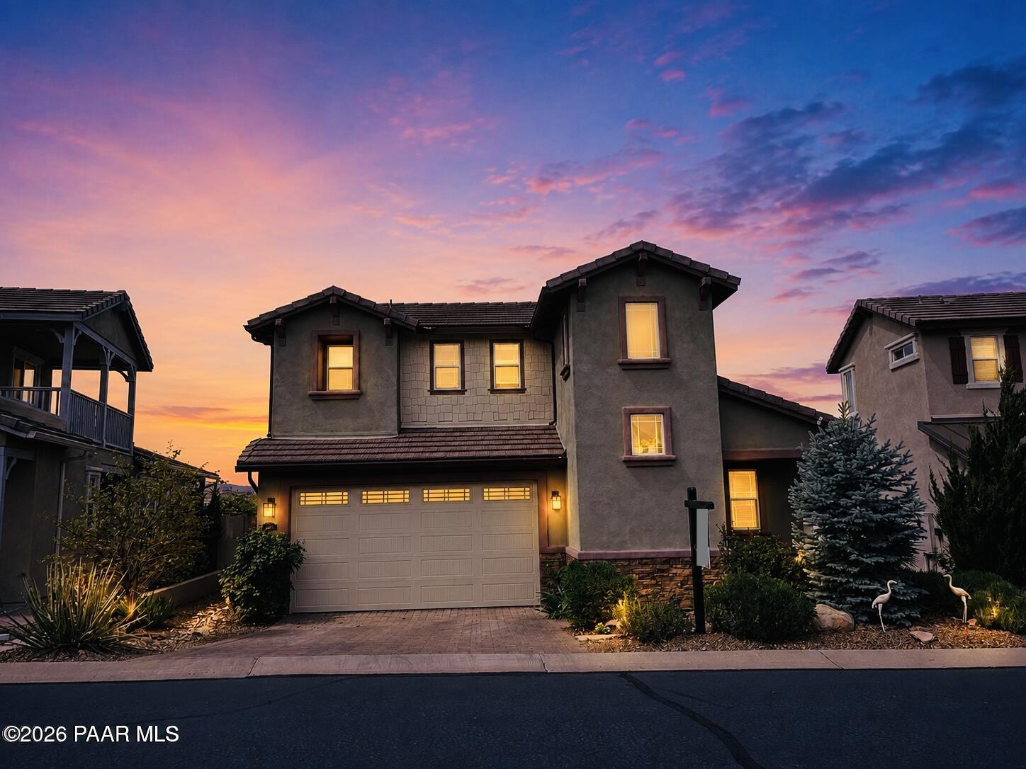 NEWER BUILT HOME IN PRESCOTT LAKES WITH PANORAMIC STUNNING MOUNTAIN VIEWS!!! This move-in ready, energy-efficient home is situated on a premium $20,000 mountain view lot in the hilltop gated community of Astoria within sought after Prescott Lakes. This beautifully appointed Craftsman style home offers an open concept, main level living, floor plan featuring 2 bedrooms, 2.5 bathrooms, plus a versatile upstairs flex space that can easily serve as a third bedroom, office, media room, or family room. The home has also been recently upgraded with beautiful luxury vinyl plank (LVP) flooring, adding both style and durability throughout the living areas. The upgraded kitchen is designed for both everyday living and entertaining, showcasing granite countertops, a stylish tile backsplash, dovetail cabinetry throughout, a newer Bosch dishwasher, a spacious walk-in pantry, and a large center island with comfortable seating for three. Wake up to breathtaking mountain views from the primary suite, complete with a generous walk-in closet and a beautifully upgraded $9,000 bathroom featuring a spacious walk-in tiled shower with bench seating. The inviting living room offers a gas fireplace with an attractive wood mantel, abundant natural light, and a large 12 foot sliding glass door that opens to the covered patio. From here, enjoy panoramic views of Granite Mountain, the Bradshaw Mountains, and Prescott's unforgettable sunrises and sunsets. The fully fenced backyard has been thoughtfully enhanced with approximately $20,000 in low maintenance landscaping, including an extended paver patio, two large raised garden beds, mature peach and plum trees, and a programmable drip irrigation system. The main level also features a dining area, powder room, spacious laundry room, an extra deep storage closet, and additional under stair storage. Upstairs you'll find a private guest bedroom, a full bathroom, and the flexible bonus room that adapts to your lifestyle needs. The home is equipped with a solar energy system that has saved the owners hundreds of dollars year after year, with the option for the new owner to purchase the system. Ideally located in the heart of Prescott, this home is just minutes from Historic Downtown Prescott's Courthouse Square, Costco, Yavapai Regional Medical Center, the VA Medical Center, Walmart, Safeway, Trader Joe's, Fry's, shopping, dining, and everyday conveniences. Within walking distance is the exclusive members only Prescott Lakes Athletic Club, offering private golf, indoor and outdoor pools, tennis, pickleball, bocce ball courts, a fitness center, exercise classes, social clubs, a restaurant, and numerous community events. Outdoor enthusiasts will also appreciate being just minutes from Willow Lake and Watson Lake, two of Prescott's premier recreational destinations. Experience exceptional views, quality upgrades, outstanding amenities, and one of Prescott's most desirable neighborhoods. Come discover why Prescott Lakes is one of the area's most sought after places to call home!
