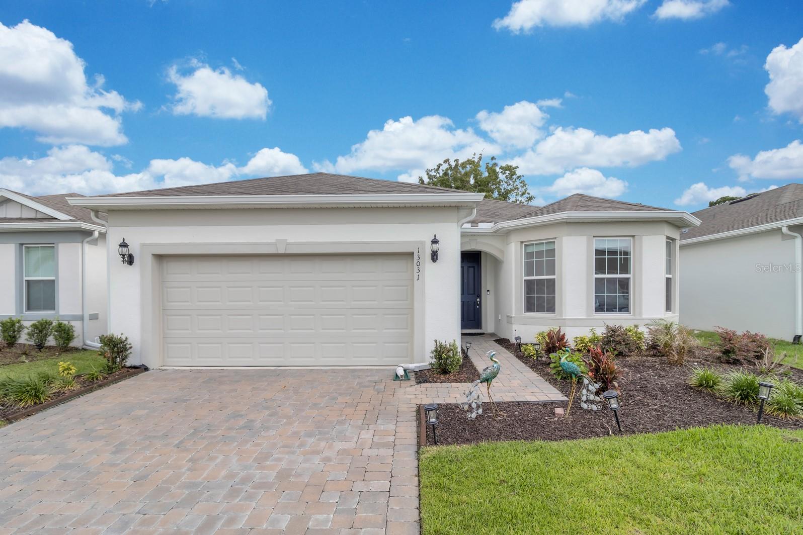 Gorgeous 4 BR/3 BA/2 car garage only 2 years old one level home located in the newest community close to Waterford Town Center area in East Orlando. Home features energy-efficient windows, high ceilings, high doors and high baseboards, open concept kitchen w/quartz countertop, huge island in the kitchen, Customer made built-in shelves in laundry room, all new light fixtures in all rooms, new rain gutters, and screened-in lanai. Glass doors in the Living Room. 50k+ upgrades for the house including 42-inch kitchen cabinets, Gourmet kitchen, LVP floors in common areas, modern glass doors for the master bathroom shower, soft close on kitchen cabinets and drawers, backsplash in the kitchen, Garden/Landscape professional done, Back to trees, monthly HOA fee includes 1GB internet. Close to major highways, 417, 408 & 528, 1 mile to Waterford Lakes Town center that includes great restaurants, 100+ stores, and shopping centers, Walmart, Target, Home Depot, Lowes & Publix, Sprouts grocery stores are nearby. Close to Orlando International Airport, Orlando Downtown, the University of Central Florida, Lake Nona Medical Center, and the Orlando VA hospital. Hurry up... before it is gone!