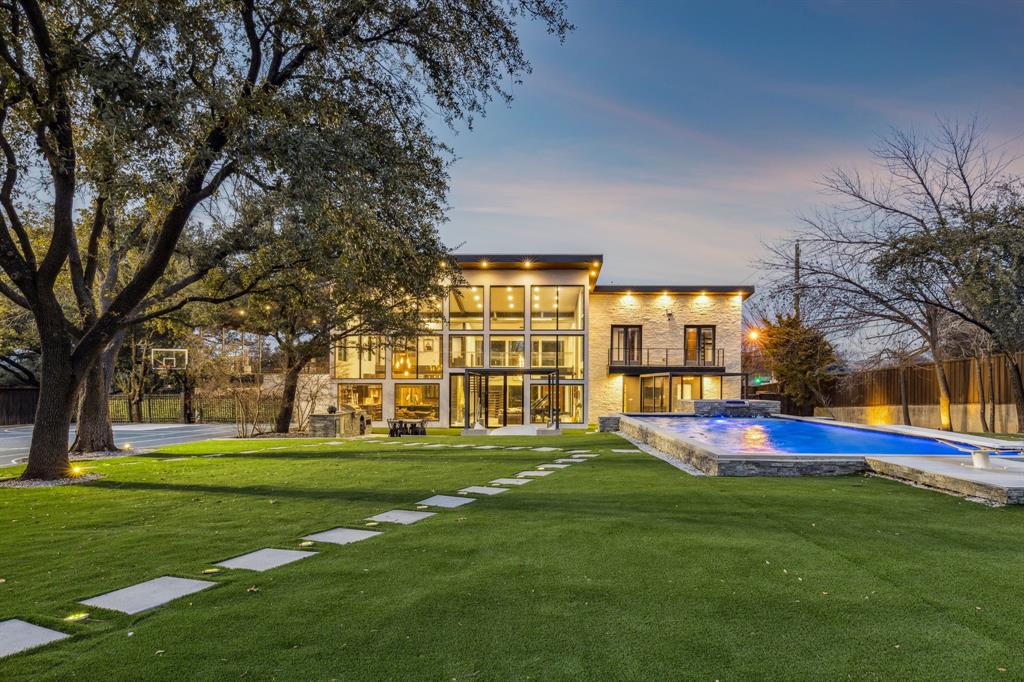 Welcome to 6766 Northaven Road, a remarkable Preston Hollow estate situated on nearly an acre of beautifully landscaped grounds. Designed to blur the line between indoors and out, this contemporary residence is filled with natural light, expansive living spaces, and walls of glass overlooking the resort-style backyard. Outdoor amenities include a pool and spa, putting green, sports court, outdoor entertaining areas, and mature trees that create an exceptional sense of privacy. Whether hosting guests or enjoying a quiet evening at home, the property offers a lifestyle rarely found in Dallas. Ideally located near the city's finest dining, shopping, and private schools, this is luxury living designed for both relaxation and entertainment.