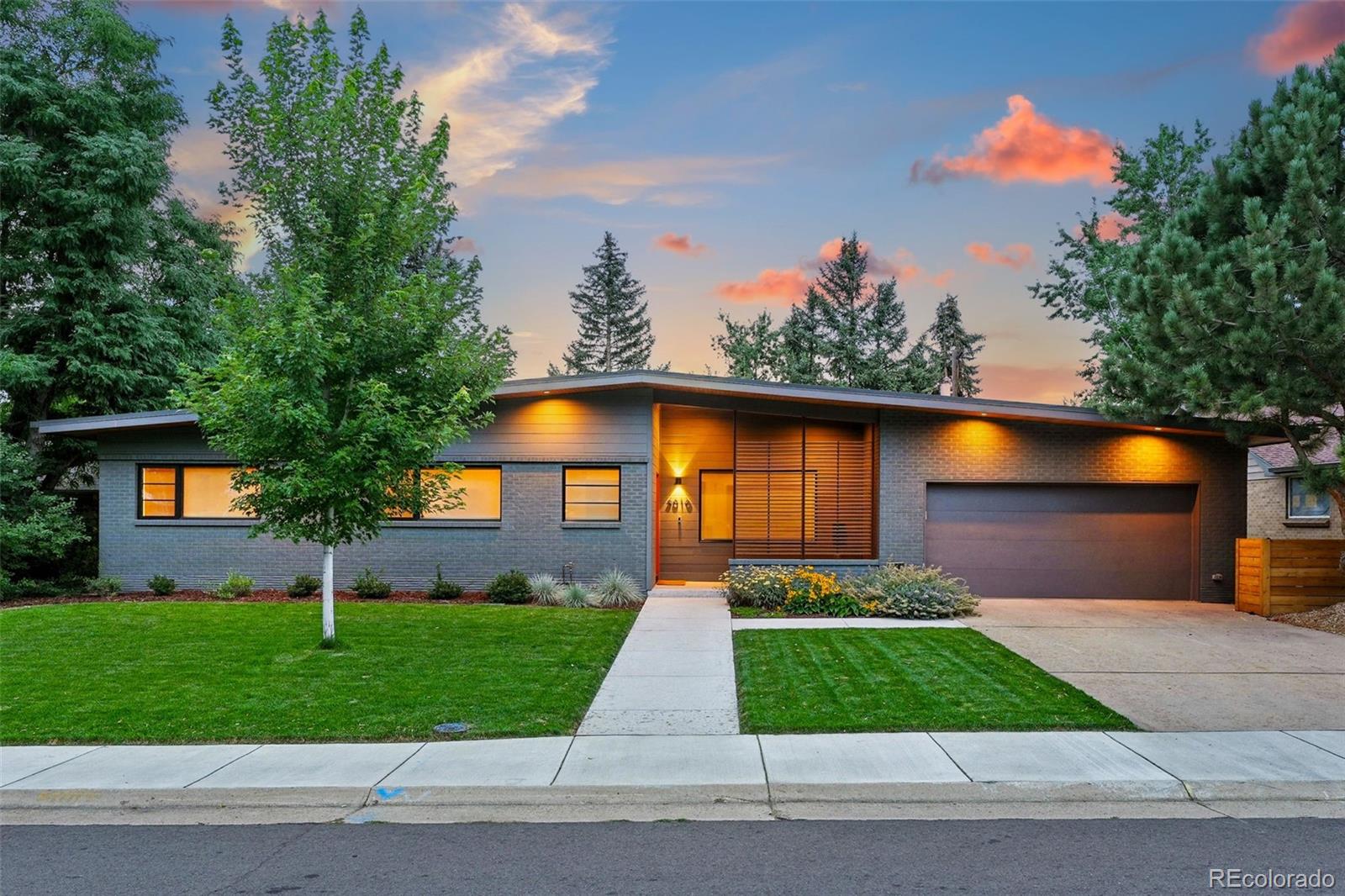 Introducing 3010 South Franklin Street, a beautifully reimagined Mid-Century ranch within the acclaimed Slavens K-8 boundary. Rebuilt and expanded in 2022 with nearly 900 additional square feet, this exceptional 4-bedroom, 3-bath home combines modern luxury with everyday living, wellness-focused systems, and premium craftsmanship throughout. Designed for effortless one-level living, the light-filled interior offers nearly 2,400 square feet with new windows, 4” white oak hardwood floors, curated finishes, and seamless indoor-outdoor flow. The gourmet kitchen is both functional and stunning, featuring Silestone countertops, stainless appliances, custom cabinetry, walk-in pantry, and oversized island. Oversized sliding doors connect the dining area to the covered patio, while the inviting living room centers around a gas fireplace with handcrafted Heath Ceramics tile and custom built-ins. The private primary suite is a true retreat with a spa-inspired bath, organized walk-in closet, and access to the Ipe hardwood deck overlooking the backyard. There are also two additional bedrooms, a full bath, plus a flexible fourth bedroom with nearby three-quarter bath that are ideal for guests, home office, or gym. Additional highlights include a large laundry room with ample storage and LG washer/dryer, attached 2-car garage with EV-ready outlet, backyard with expansive lawn and solar-lit storage shed, and exterior trimmed with hemlock soffits. Behind the scenes, the home is equally impressive with high-performance construction and wellness-centered upgrades: Weather Shield windows, AeroBarrier technology, Panasonic ERV ventilation, whole-home air purification and humidification, under-sink water filtration, radon mitigation system, enhanced soundproofing, smart-home features + Cat6 cable, solid-core doors, designer window coverings. Enjoy nearby parks, shopping and dining, plus easy access to Cherry Creek, downtown, DTC - all from one of Denver’s most desirable neighborhoods.