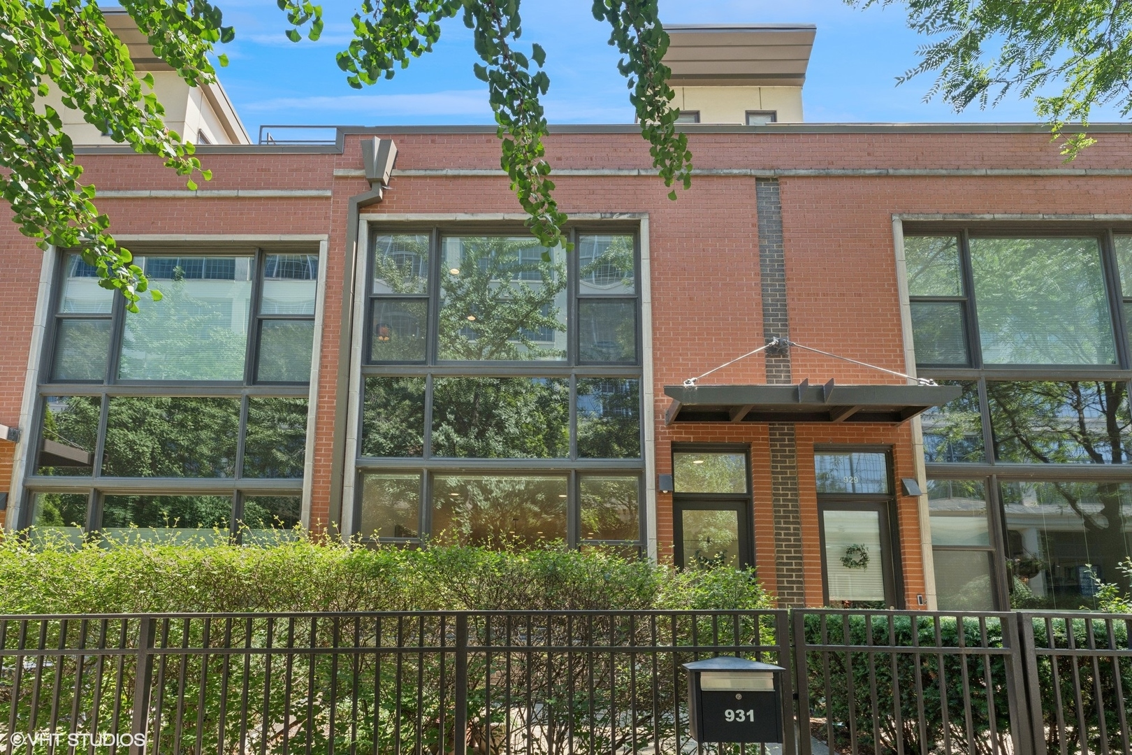 Come check out this show-stopping River Village Townhouse, perfectly situated between Chicago Ave and Division, offering the best of city living with a laid-back neighborhood feel. This beautifully updated home features two spacious bedrooms and two and a half bathrooms, blending comfort and style in one of Chicago's most desirable locations. Step into the open and airy living and dining area, where massive windows flood the space with natural light and newer hardwood flooring flows seamlessly throughout. The kitchen is an entertainer's dream, complete with stainless steel appliances, sleek white cabinetry, and stunning Quartz countertops. Cute and convenient half bath on main level. Upstairs, the primary bedroom offers a serene retreat with two large custom closets and a private en-suite bathroom, while the second bedroom boasts soaring 14-foot ceilings, expansive windows, and ample closet space. Head up to the private rooftop deck, outfitted with composite decking, a built-in gas line for grilling, and the potential for an irrigation system or water feature-perfect for relaxing or entertaining. Additional features include an in-unit washer and dryer on the first floor, assigned storage, and garage parking included in the price. Located just steps from the Riverwalk, top restaurants, shopping, grocery stores, public transit, and easy access to 90/94, this home truly has it all-don't miss your chance to see it in person!