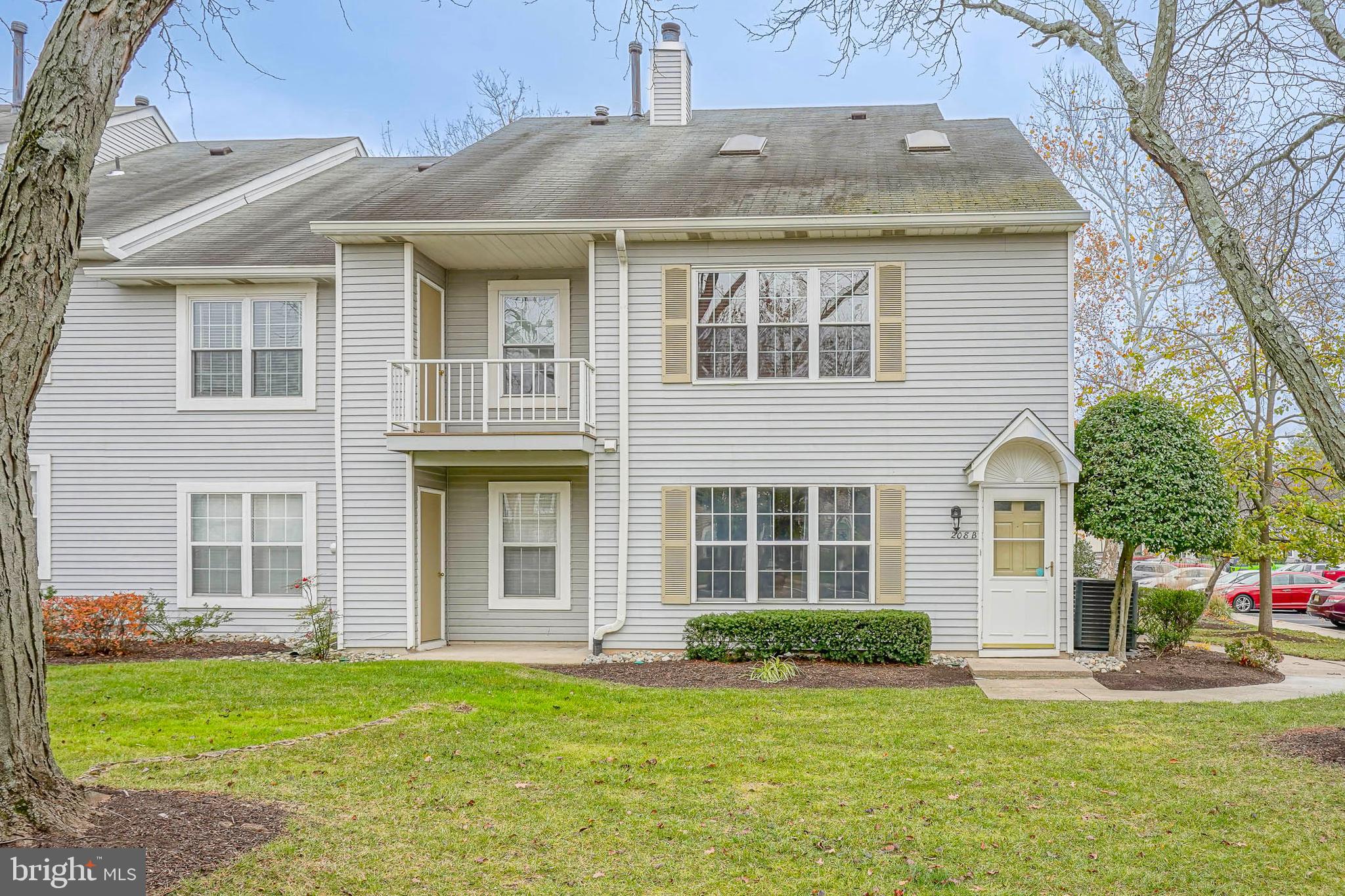 Fresh, bright, and move-in ready, this 2 bed, 2 bath Laurel Place condo with a spacious loft checks all the boxes. Enjoy brand-new carpeting, fresh paint throughout, new stainless steel appliances,  updated bathrooms, and updated lighting. As you come up the stairs, you'll immediately find that this spacious 2nd floor condo includes so many fabulous features. The updated kitchen boasts granite counters, plenty of cabintery, new Stainless Steel appliances, pendant lighting, and a pass through to the dining room. The oversized living area is highlighted by hardwood floors, soaring vaulted ceilings with skylights providing an abundance of natural light, and an expansive built in library with rolling ladder. Down the hall, the primary bedroom feautres a generously sized walk in closet with organiztion system,  updated ensuite bath, and brand new carpeting. The second bedroom features beautiful and convenient built ins, as well as brand new carpeting. An updated hall bath is ideally located for the 2nd bedroom or guests. Upstairs, the newly carpeted spacious loft with a cozy wood burning fireplace is ideal for a game room, study/home office, or playroom...the possibilities are endless! Other highlights include wood trim detailing, balcony with large storage closet, main floor laundry, and a convenient location near the parking lot. Located in a fantastic community in walking distance to  shopping, dining, and parks, and just minutes away from major roads and schools—this one is the perfect blend of comfort and convenience. Don't miss it!