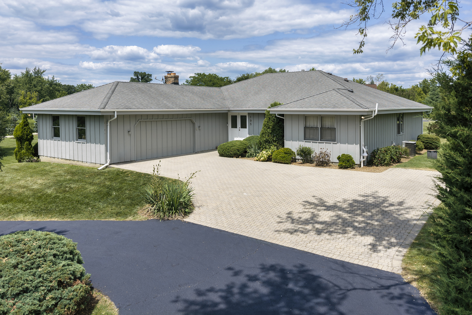 Located in highly sought-after District 95, this expansive ranch offers the perfect blend of privacy, versatility, and modern improvements on a picturesque 2+ acre setting. Tucked away on a rolling lane that was once part of the historic Bells Apple Orchard, the property features mature trees, a large barn, and a peaceful setting just minutes from Route 12, Deer Park Town Center, and Lifetime Fitness. The home offers 6 bedrooms and 3 full bathrooms, including 4 bedrooms and 2 baths on the main level. The updated main-floor kitchen features refreshed cabinetry, a center island, and new range and dishwasher, plus a Sub-Zero refrigerator. creating a functional space for everyday living and entertaining. Fresh paint and flooring throughout provide a clean, modern feel. The spacious primary suite includes a large sliding glass door overlooking the scenic grounds, while expansive living spaces offer flexibility for today's lifestyle, including an ideal home office option. Main level Family room features wood-burning fireplace and opens to large deck for outside enjoyment. The walkout lower level lives like a separate residence, making it perfect for multigenerational living or guests. It includes 2 additional bedrooms, a Jack-and-Jill bathroom, a full second kitchen with all new appliances, 2nd laundry room, a comfortable living area with fireplace, and direct exterior access to patio for added privacy and convenience.  Surrounded by remnants of the original orchard and rich local history, this unique property offers a rare combination of acreage, character, flexibility, and modern updates in one of Barrington's most desirable locations. A truly exceptional opportunity.
