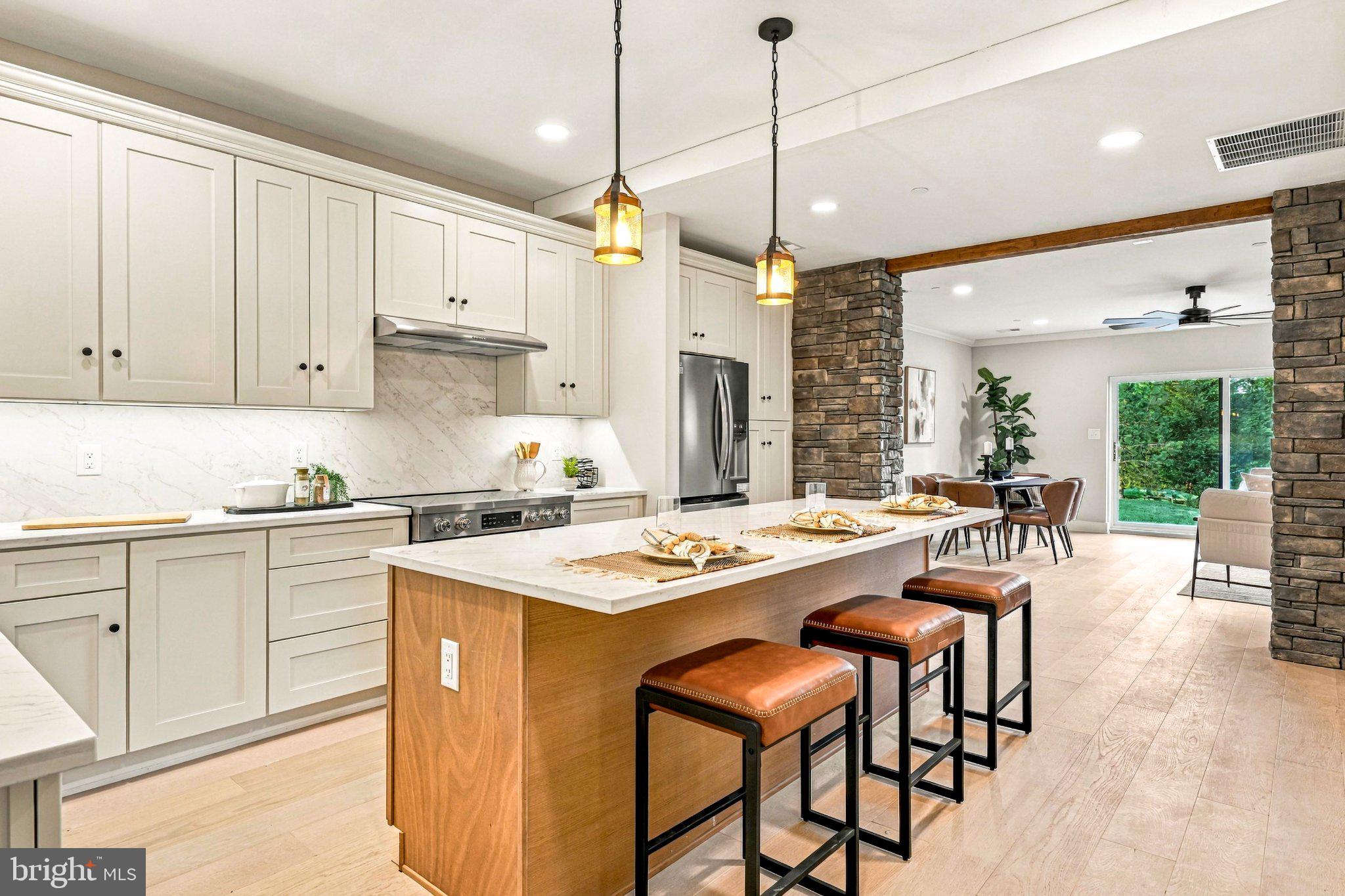 Introducing Greenridge Commons, a distinctive collection of twelve bespoke two-story residences thoughtfully created through the adaptive reuse of a historic local school in beautiful Glenmoore, within the award-winning Downingtown Area School District and highly regarded STEM Academy. Rather than starting with a blank slate, Greenridge Commons preserves the character, scale and substantial construction of the original building while transforming it into twelve sophisticated new residences with beautifully appointed, all-new interiors and inviting community green space. Anything but cookie-cutter, each home offers a thoughtful blend of modern design, individuality and historic character. Open-concept floor plans are filled with natural light and finished with high-quality materials and carefully considered details. Kitchens feature quartz countertops, beautiful cabinetry, oversized center islands, stainless steel appliances and distinctive stonework details that thoughtfully echo the character of the original building. Additional highlights include beautifully tiled baths, spacious walk-in closets, private balconies or patios, solar tube lighting and energy-efficient construction. Ten interior residences offer spacious open-concept living on the main level, with three bedrooms and convenient laundry on the second floor. Two larger carriage-home-style end residences offer an elevated sense of space and privacy, with additional windows, beautiful views, dedicated dining rooms and exceptionally spacious second-floor bedrooms. One end residence also offers the opportunity to create a first-floor primary suite. Inquire for additional details and available options.Southern-facing residences enjoy southern exposure, while homes on the northern side of the building offer north/northeastern exposure, creating a variety of natural-light orientations throughout the community. The building itself retains distinctive elements of its original construction, including substantial block walls thoughtfully incorporated into the exterior and complemented by stucco, along with a newer roof. The result is a rare combination of the scale, substance and character of an established building with the finishes, systems and functionality of a brand-new home. Greenridge Commons offers an intimate setting surrounded by mature greenery and open landscapes, with convenient access to shopping, dining, parks and major commuter routes. Residents will enjoy covered parking, community green space and a community room designed for gatherings and shared activities.Located just minutes from downtown Eagle, Marsh Creek State Park and Springton Manor Farm, Greenridge Commons offers the opportunity to enjoy a quiet suburban setting with easy access to the amenities of the surrounding area—all with the convenience of low-maintenance living.