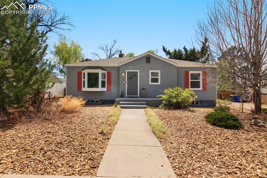 This home is beyond adorable—beautifully modernized while preserving its original charm. Ideally located near Patty Jewett Golf Course, Colorado College, and all the shops and restaurants downtown. The main level features stunning hardwood floors and a fully remodeled kitchen complete with quartz countertops, subway tile backsplash, and stainless-steel appliances. The light-filled living and dining areas showcase large windows with lovely views. Your primary bedroom offers wood flooring, walk-in closet, mountain views and attached bath. The secondary bedroom also with mountain views and additional full bath completes the main level. The finished lower level offers additional living space with a spacious family room, two more bedrooms, and a generously sized laundry room with washer & dryer and ample storage. Step outside to your landscaped backyard featuring garden beds, a lawn area, and a 6-foot privacy fence. The concrete patio creates the perfect setting for entertaining, while partial xeriscaping ensures low-maintenance living. Additional highlights include A/C, updated windows, sprinkler system, storage (Tuff) shed, large RV parking pad, and alley access. This home is not to be missed!