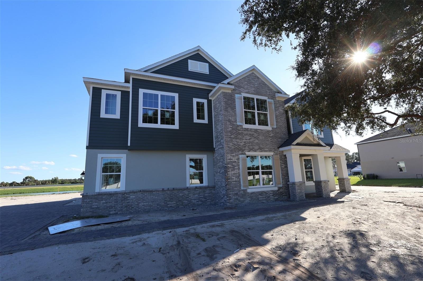 Under Construction. Located at 17030 Overstory Road in Orlando, this stunning new construction home is now for sale! This exceptional home features 5 spacious bedrooms including a first-floor guest suite, a first-floor den, a formal dining area, an open-concept living space, a spacious loft, a convenient second-floor laundry room, and more. This new construction home combines elegant design with practical functionality, offering generous room sizes and a layout that maximizes both privacy and shared living areas. The open-concept design creates a natural flow between kitchen, dining, and living areas, making this home ideal for both everyday living and special occasions. Located on the second floor, your owner's bedroom provides a peaceful retreat away from the main living areas, while the additional bedrooms offer ample space for family members or guests. With 4.5 bathrooms strategically placed throughout the home, morning routines will be streamlined and efficient. The second floor also holds the laundry room, spacious loft, and a lounge area.