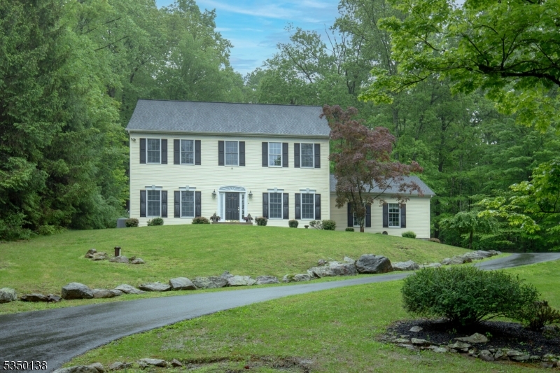 Stately Federal Colonial!  Breathtaking panoramas characterize the 3.32 cul-de-sac acres of open, wooded-landscaped mountain view surroundings. A well-designed floor plan provides four bedrooms, three-and-a-half baths. Highlights of this gracious residence include cherry wood and tile flooring on main level, nine-foot first-floor ceilings edged by custom crown and dentil moldings, French doors, recessed lighting, and Andersen windows. The stately exterior features maintenance-free vinyl siding, a 2014 asphalt shingle roof, a maintenance-free Epoch deck, a rear stone retaining wall, paver stone walkways, and a graceful arbor in the entertainment-friendly rear yard. The welcoming foyer opens to the formal dining room and elegant living room warmed by a Heatilator fireplace. Designed with the chef in mind, an impressive kitchen presents furniture-grade maple cabinetry finished in a warmly-toned glaze, granite counters, stainless steel appliances and ceramic tile flooring. Making meal preparation easy, the kitchen opens to the spacious family room with French doors to the expansive rear deck. Inviting primary suite offers a spacious bedroom, walk-in closet, & an indulgent, remodeled 2019, primary spa bath. Three additional bedrooms share another full bath, while a convenient laundry rm completes this level.  A finished lower level includes a recreation room, exercise room, full bath, office/craft room, and storage/utility rms. There is a two-car attached garage. Close to Oldwick.
