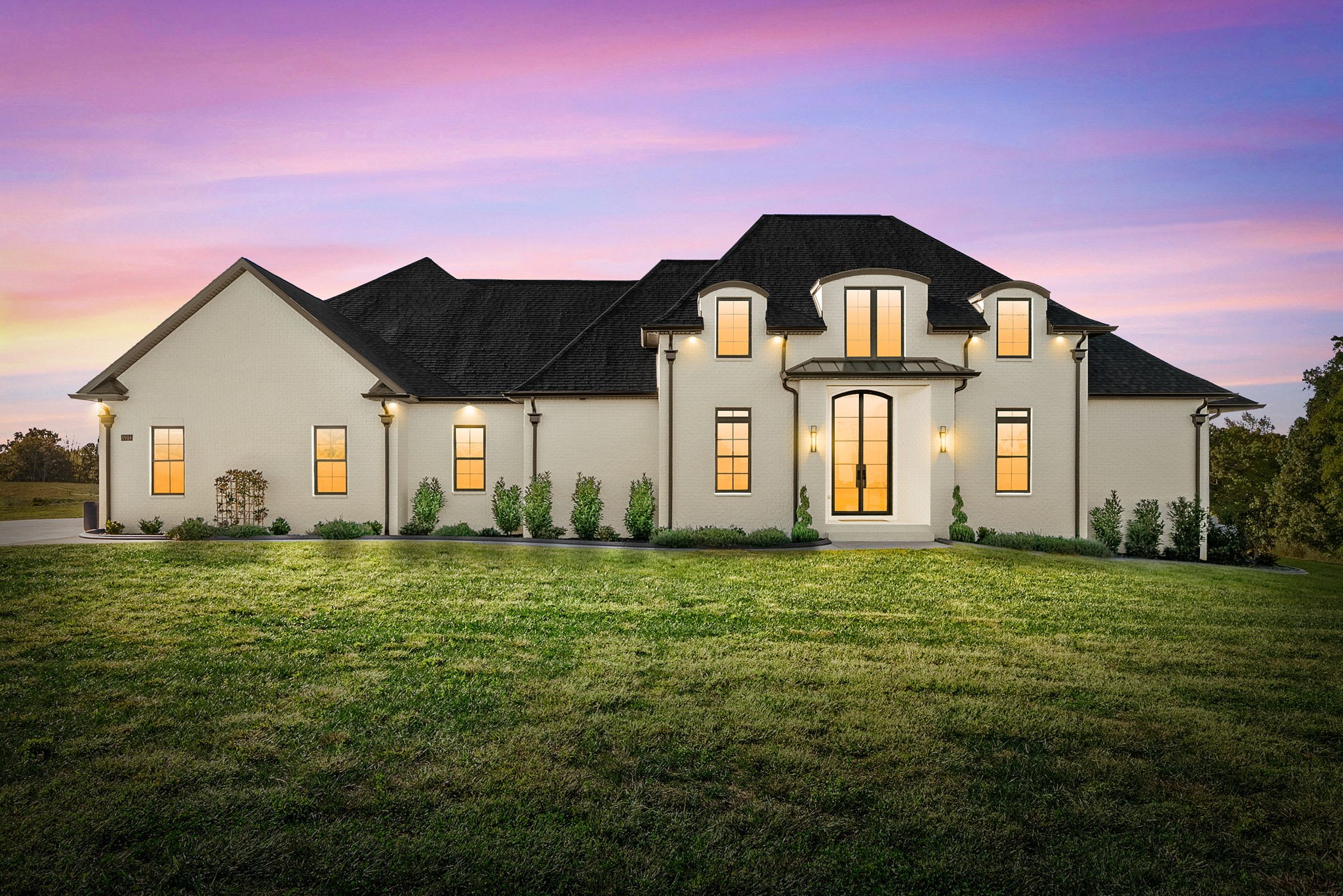 The one you’ve been waiting for 1914 Hickory Point Rd, where space, privacy, and intentional design come together.Sitting on 15 acres, this custom-built home offers over 4,300 square feet, 5 bedrooms, 4.5 baths, a spacious bonus room, and a 3-car garage bringing together thoughtful design and rare acreage in one unforgettable property. You’re welcomed by high ceilings and natural light that create a bright, expansive feel. The open-concept living space is anchored by custom built-ins, floating wood shelving, a sleek fireplace, and designer lighting throughout. The kitchen is a true showstopper. Custom cabinetry, quartz countertops, an oversized island, gas range with pot filler, stainless appliances, and a large walk-in pantry make this space both beautiful and functional The primary suite feels like a private retreat with spa-inspired bath featuring a freestanding soaking tub, tiled walk-in shower, and an expansive custom closet. Just off the suite, a versatile hobby room offers flexible space for a home office, fitness area, or private lounge. Each additional bedroom is generously sized with abundant closet space. The fifth bedroom, located just off the bonus room, creates an ideal setup for an in-law suite, private guest quarters, or extended living space. Sliding glass doors open to a covered porch where open skies and peaceful surroundings create the perfect place to unwind. The 3-car garage includes a built-in storm shelter for added peace of mind. From designer finishes to spray foam insulation, the attention to detail throughout reflects the intentional quality of this home. Surrounded by privacy yet conveniently located near dining, amenities, and commuter routes, this property delivers both seclusion and accessibility. If you’ve been searching for acreage, scale, and intentional custom design. This is the one. What are you waiting for? Come see it for yourself today!