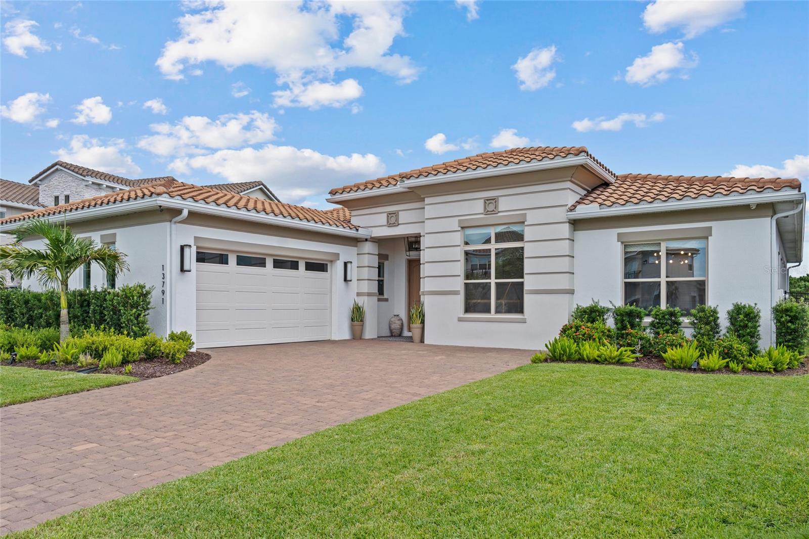 Under contract-accepting backup offers. !!!PRICE IMPROVEMENT!!! Welcome to luxury living in Eagle Creek—one of Lake Nona’s most sought-after gated golf communities. This stunning 4-bedroom, 4-full bath residence perfectly blends modern and elegance. Experience everyday comfort located on a quiet could-de-sac, tucked away with rear conservation views, spacious living, and generously thoughtful upgrades throughout. Step inside to an inviting open floor plan highlighted by natural light, extended ceilings, and custom finishes. The gourmet kitchen features sleek quartz countertops, built-in oven, glass cook top, oversized walk-in pantry, coffee/dry bar and a large island that opens to the dining area and great room—ideal for gathering and entertaining. A wall of glass sliders extends the living space to the covered lanai (operated by remote control functions), where you can dine or relax while overlooking the peaceful conservatory views with no rear neighbors. Living room is equipped with built-in surround sound speakers. This single story home has 4 bedrooms and 4 full bathrooms. The expansive primary suite offers peaceful conservation views and private access to a covered lanai—the perfect place to enjoy your morning coffee or sunset breeze. The spa-inspired bath features dual vanities, a large glass-enclosed shower with pebble flooring, and a spacious custom walk-in closet with built-ins and a center island. Outside, the fully fenced backyard features mature landscaping ideal for low-maintenance play and entertaining year-round. This home is equipped with a security system and electrical hook-up for tesla charging (charger does not convey). Eagle Creek residents enjoy resort-style amenities including multiple pools and a splash zone, clubhouse with gym equipment and an open space for events, lighted tennis courts, playground(s), dog park(s), and multi-use fields. Golf lovers will appreciate the community’s championship course, pro-shop, and on-site restaurant—all just steps away from your very own front door! Zoned for top-rated Lake Nona schools and moments from Medical City, shopping, dining, and theme parks, this home delivers family-friendly luxury in one of Orlando’s premier locations.