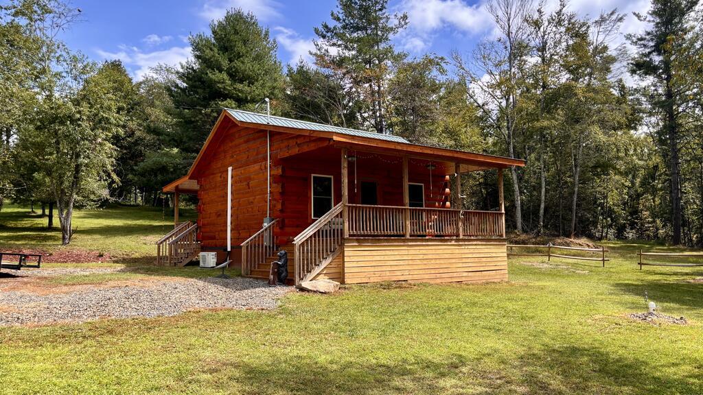 Welcome to this brand-new, move-in-ready log cabin set on 2.4 scenic acres in Fancy Gap. Enjoy picturesque countryside views and the peaceful sounds of the stream flowing through the property. The serene acreage offers a true haven for nature lovers, frequently attracting local wildlife including white-tailed deer, black bears, and small game. Whether you are looking for a personal mountain getaway, a high-potential vacation rental/Airbnb, or a cozy full-time residence, this custom home delivers modern comfort in an idyllic natural setting.