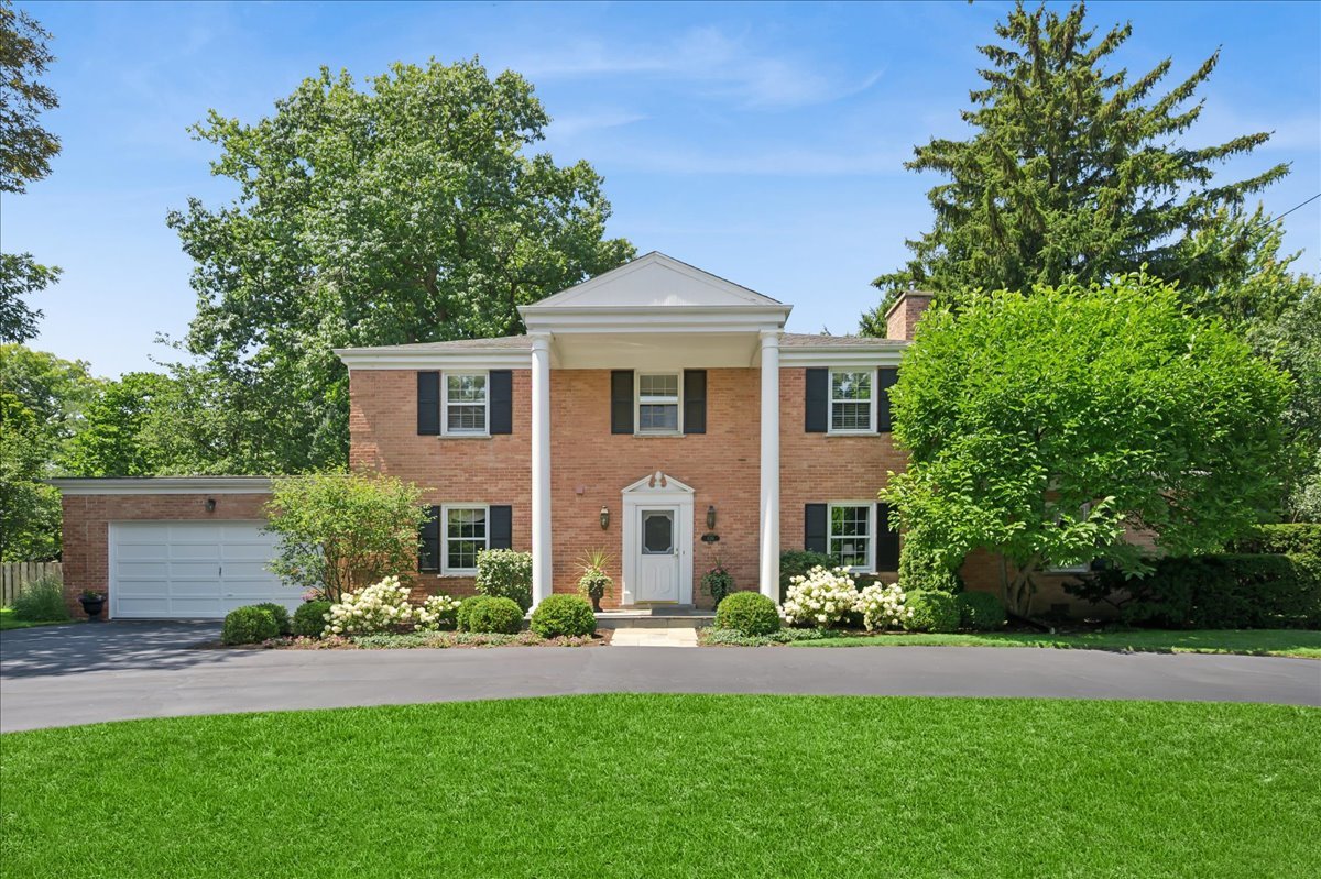 Enjoy an East Winnetka lifestyle on a beautifully landscaped expansive .3 acre all brick home in an ideal location, only blocks to Tower Road beach, Hubbard Woods/Winnetka shops and restaurants, schools, parks, and train. This sophisticated Georgian offering a great circular floorplan, grandly scaled rooms filled with natural light, fabulous outdoor spaces with a fully fenced yard, and an attached 2+-car garage, is perfect for seamless everyday living and entertaining. The welcoming foyer with a gracious staircase centers the home and opens to a spacious sunny living room with a gas log fireplace and handsome mantel.  A comfortable family room with custom built-ins and oversized windows has panoramic vistas of the grounds and mature trees.The gourmet kitchen features custom cabinetry, high-end appliances, a large island with table seating, and a sitting area for play or relaxation with access to a private patio to enjoy al fresco dining and outdoor living.  The elegant dining room is ideal for any size gathering. Upstairs the private primary includes a renovated ensuite bath and a large cedar lined walk-in custom closet. 3 additional generously sized bedrooms share a beautifully renovated hall bath with a double sink.  The basement with laundry has abundant storage and awaits your design ideas.  Hardwood flooring is under all carpeting. This is a great opportunity for a timeless East Winnetka home in a walk-to-all location.
