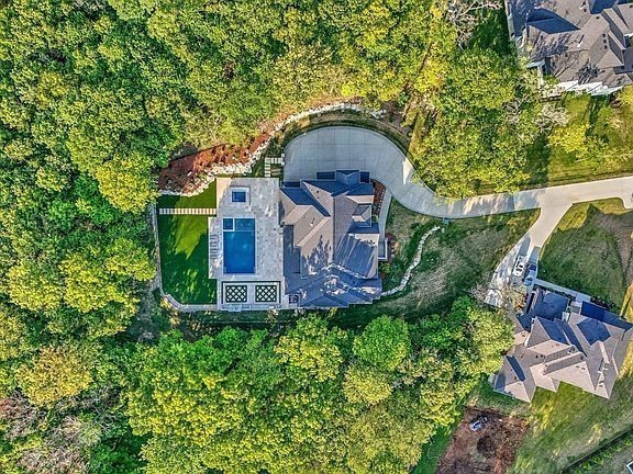 Must see “Chateau Soleil” one owner, one of a kind custom newer luxury const.  Rare PRIVATE Estate Enclave (approved for Gated Entrance)- 2+ Private ACRES IN FRANKLIN, TN.  NO LUXURY FEATURE LEFT OUT! Premium homesite backing to treed forested common space.  This exquisite residence offers 5 generously sized ensuite Brms, 3 half baths, theater w/ surround sound, 3 bonus rooms - one on the main level w/ separate entrance possible in-law suite w/ kitchen; chef’s kitchen (w/ high end Miele appliances, grand quartz-topped center island, 2 sinks; custom vent; 2 dishwashers, central vac., high end plumbing fixtures, a custom walk-in pantry with floor-to-ceiling cabinetry), 5 wine fridges, 3 fps; large formal dining for 12+; beautiful built ins; fully customized closets; soaring 20 ft ceilings w/ beams plus ceiling treatments; office w/ views. Step outside to a entertainer’s dream: treelined sanctuary w/seamless indoor/outdoor living w/ 4-panel sliders to extended covered porch to saltwater gunnite pool w/ tanning ledge, spa, cold plunge, smoker, grill, 2 fireplaces, pizza oven. Room to build possible tennis courts or guest/pool house. Zoned for Top Schools: Ravenwood, Clovercroft, & Woodlands. (Step outside to your private, tree-lined sanctuary, where a custom saltwater pool with tanning ledge, hot tub, and cold plunge await. The outdoor kitchen is a true entertainer’s dream, boasting a built-in smoker, gas grill, pizza oven fireplace, and refrigerator—all set on an expansive travertine patio. Appraised for $5.1 million- unmatched privacy, outdoor living and luxury.