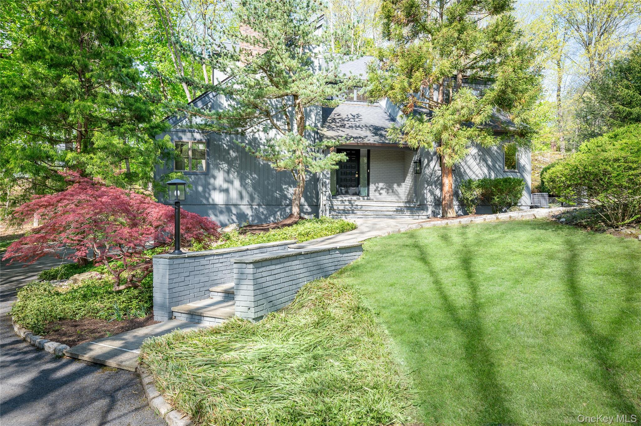Attractive contemporary home ideally located near town, offering over 3,000 square feet of light-filled living space with soaring ceilings and a wonderful open flow for today’s lifestyle. This 4-bedroom home features a spacious cook’s kitchen, three fireplaces, and generously scaled rooms designed for comfortable everyday living and easy entertaining. A flexible first-floor room plus full bath provides the perfect option for a 5th bedroom, guest suite, or home office. Enjoy summer evenings on the amazing screened porch overlooking the property. A rare opportunity combining style, space, and convenience.