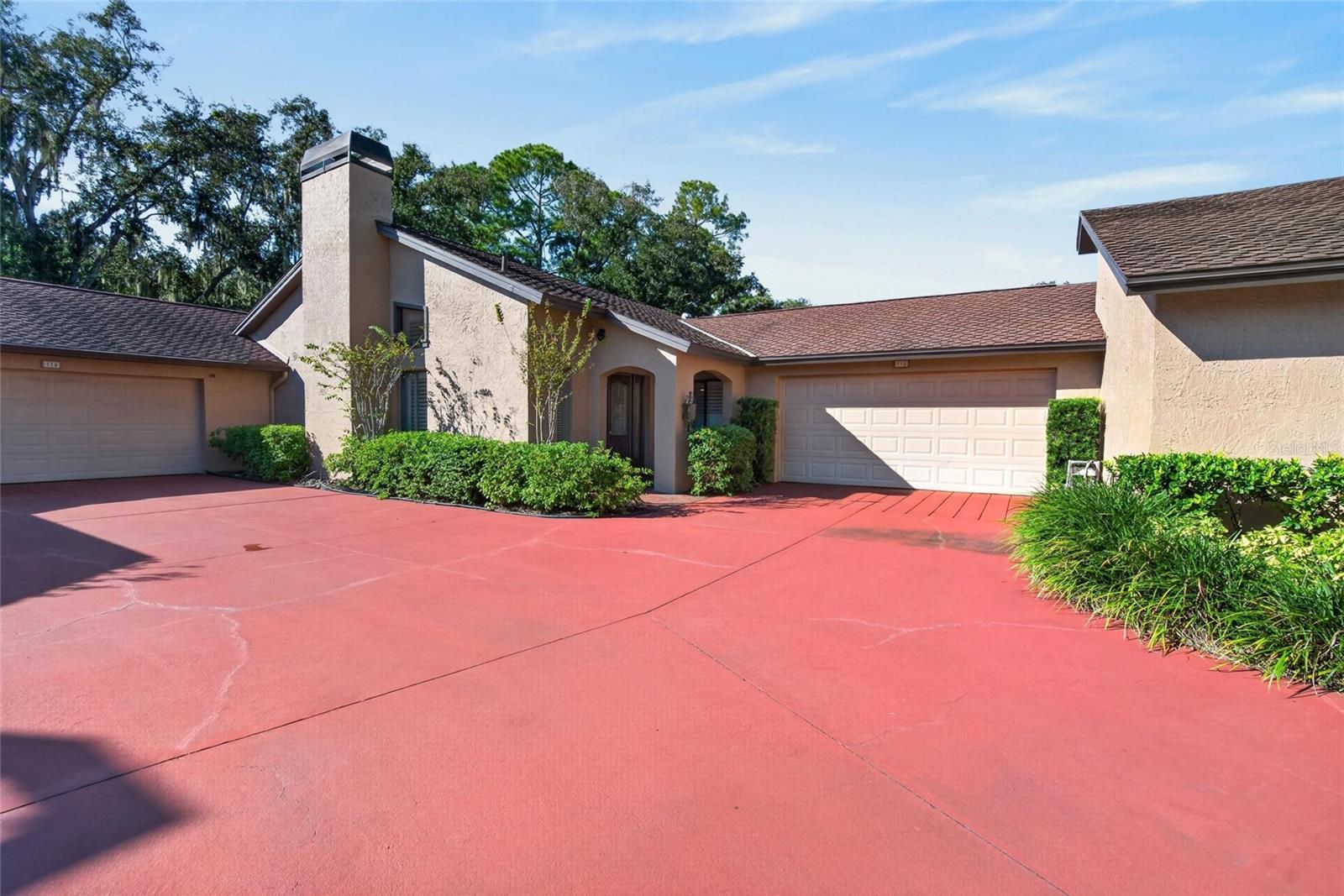 Welcome to this charming 2-bedroom, 2.5-bathroom single-family home in the gated La Viva community in Brandon! The thoughtfully designed split-bedroom floor plan features two spacious primary suites, each with a private ensuite bathroom showcasing an oversized tiled walk-in shower. Additional highlights include double shower heads, multiple vanities, and an oversized walk-in closet with organized shelving. A versatile bonus room adjacent to one of the primary suites offers the perfect space for a home office, den, hobby room, or additional sleeping area. Enjoy your own private outdoor retreat in the screened courtyard, complete with a sparkling swimming pool and six-person jacuzzi. Inside, the spacious, updated kitchen features a cooktop, oven, refrigerator, microwave, dishwasher, and garbage disposal. The inviting living room offers a cozy fireplace, while hardwood flooring throughout the main living areas, tile in the bathrooms, and elegant plantation shutters add warmth and character throughout the home. Additional conveniences include a dedicated laundry room with washer and dryer and an attached two-car garage with remote entry. Ideally located near shopping, dining, I-75, and the Selmon Expressway, this home combines a distinctive floor plan, private outdoor amenities, and convenient access to major commuter routes. Schedule your private showing today!