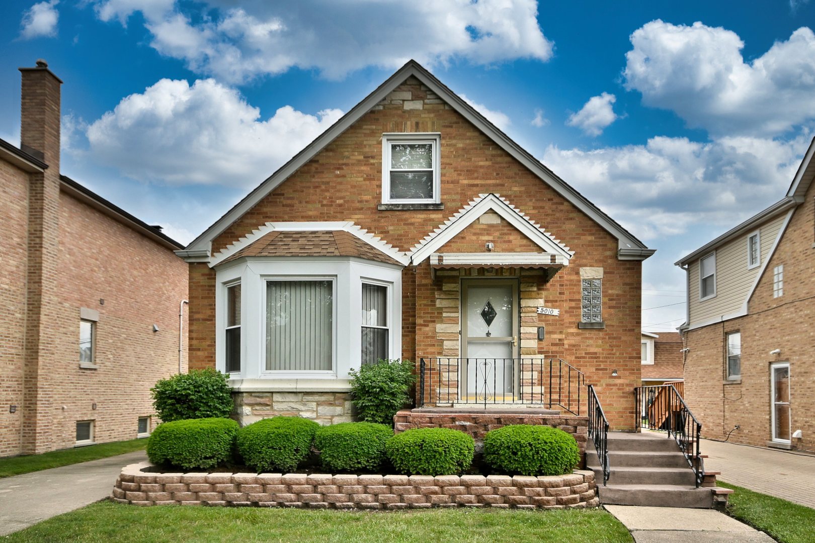 Charming 3-Bedroom, 2.1-Bath Tudor in Prime Chicago Location!!  This move-in-ready Tudor home is located in a highly sought-after area of Chicago and offers a perfect blend of character and modern comfort. The first floor features gleaming hardwood floors in the spacious living room, eat in kitchen with adjoining dining room and a main-level bedroom. The ceramic tile kitchen opens to a large deck-ideal for summer entertaining. A full bathroom completes the main level.    Upstairs, you'll find two generously sized, carpeted bedrooms and a second full bath. The finished basement provides excellent additional living space with vinyl flooring, a convenient half bath, and a separate, ample-sized laundry area. The home also includes a side drive leading to a 2-car garage.    Don't miss this opportunity to own a beautifully maintained home in a fantastic location!