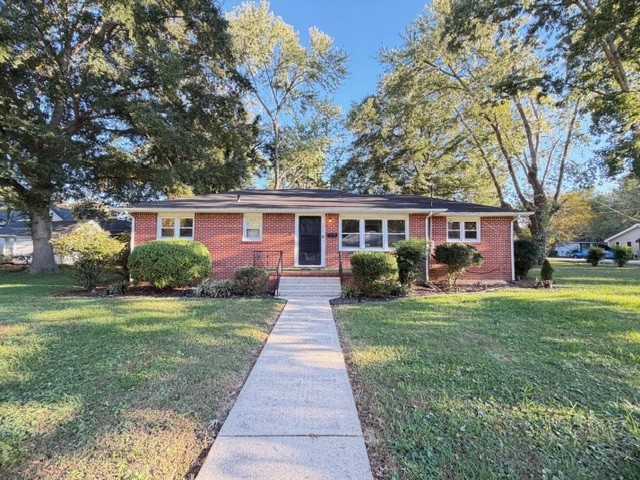 Welcome to this delightful brick home nestled on a generous corner lot surrounded by mature shade trees. Full of character and timeless appeal, this home features gleaming original hardwood floors that add warmth and authenticity throughout. Perfectly situated close to town and just minutes from Tims Ford Lake. This combines peaceful living with everyday convenience. Replacement windows throughout the home. Home selling "AS IS"