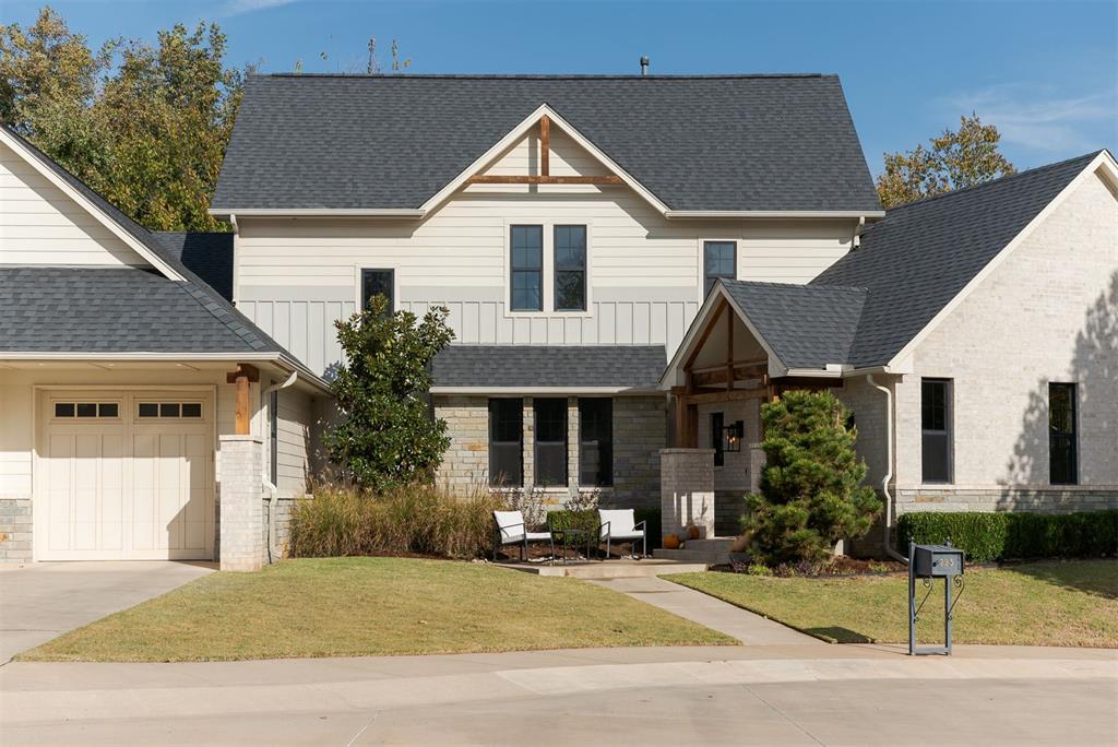 Nestled in one of Edmond’s most sought-after neighborhoods, this stunning 2,880 sq ft modern craftsman offers the perfect blend of style, comfort, and location. The home was designed by Jerry Stivers and built by Josh Moore. Tucked away in a quiet cul-de-sac and backing up to walking trails and a peaceful park, this home provides both privacy and convenience — just minutes from shopping, dining, and downtown Edmond. Step inside to find a bright, open floor plan filled with natural light from expansive windows and accented by soaring wood beams and a striking wood-burning fireplace. White oak wood flooring throughout living room and kitchen. The chef’s kitchen is designed for entertaining, featuring a 6-burner Monogram range, sub zero refrigerator, oversized island, and beautiful views of the wooded creek behind the home. The spacious primary suite is a true retreat with a spa-like soaking tub, dual vanities, and an impressive walk-in closet. Upstairs, you’ll find two generously sized bedrooms, each with its own private bath, plus a secured storage room. A large walkout attic offers potential for a second living area, home office, or additional bedroom. Tankless hot water heater. Enjoy outdoor living year-round on the expansive back patio complete with a cozy fireplace — perfect for relaxing or hosting friends. Located in the heart of Edmond, this home combines natural beauty, craftsmanship, and convenience in an unbeatable setting.