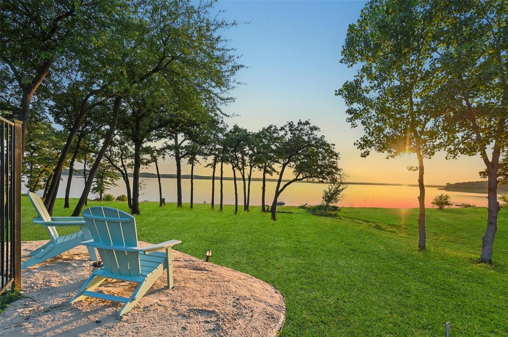 This is more than a LUXURY home, its a LIFESTYLE. THIS IS YOUR UNICORN... Welcome to this stunning and FLAWLESS Beach Custom Home perfectly situated on a RARE, private HALF-ACRE unobstructed LAKEFRONT AND ONLY WALKABLE BEACHFRONT property on coveted Lake Grapevine. This extraordinary property is the epitome of luxury living, offering the best of both worlds—a primary residence and vacation lake house all-in-one w NO HOA and still under builders warranty!!
Step into a lifestyle where every day feels like a retreat. Imagine waking up in approx. 4300sf of luxurious breathtaking water views, stepping directly onto the sandy shoreline, and enjoying the serenity of one of Texas’ most premier lakes—all from the heart of Flower Mound, recently named the #1 Best Small Town to Live in the U.S. (Forbes & Livability, 2025).
This 4bed, 5bath fully automated, smart home blends modern elegance with lakefront charm, featuring expansive open-concept living, vaulted ceilings, designer finishes, and fully expanding glass pocket doors framing panoramic lake views including a custom pool, spa and decking designed by award winning design firm, Claffey Pools. This is an entertainers paradise! Each bedroom has their own private ensuite bathroom, including an exclusive mother-in-law suite. The private half-acre lot provides endless opportunities for outdoor living—from entertaining lakeside, launching water adventures, or relaxing under the breathtaking Texas sunsets 365 days a year. 
Located in one of the most sought-after and award-winning school districts and the #1 HS in LISD—making it a perfect choice for families seeking excellence in education. With DFW International Airport just 10min away and only 20min to Dallas or Ft Worth, convenience and accessibility are unmatched.
Whether you’re seeking your forever residence, a private lake retreat, or both, it delivers the ultimate blend of sophistication, comfort, and waterfront living.
Don’t miss this once-in-a-lifetime opportunity!