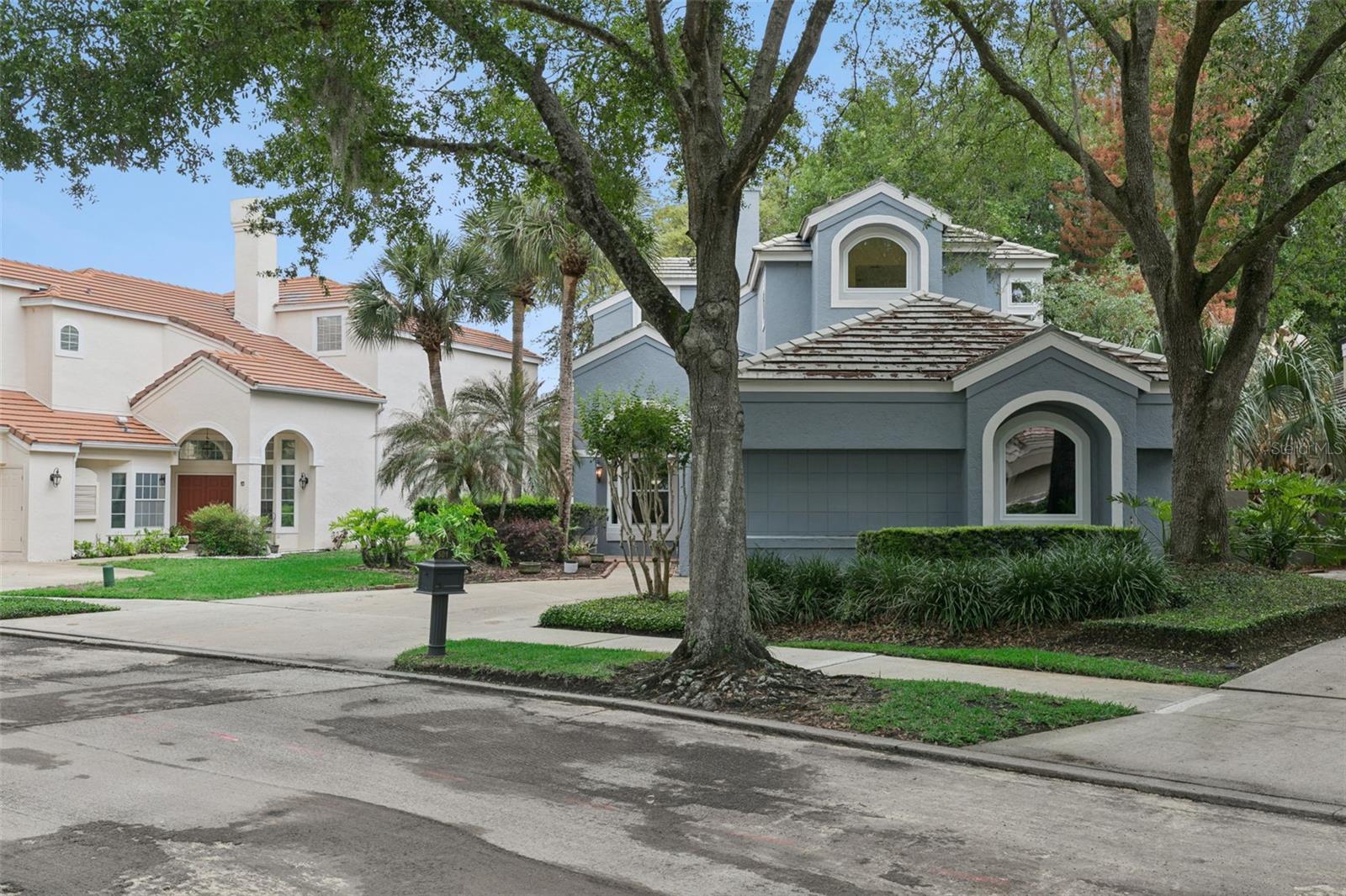 Welcome to Heathrow's Devon Green.  A single family home located near the Heathrow Golf Course.  This home features three bedrooms with three and a half bathrooms.  As of 2026, Brand New Double Pane Windows throughout the 2 story home and fresh interior paint.  As you enter, you see the light and bright home with windows that extend 2 stories.  Living room with hardwood flooring and double sided fireplace shared with the formal dining room.  Gourmet Kitchen with granite countertops, stainless steel appliances, and wood cabinetry.  Family room off the kitchen.  Downstairs you have one bedroom with private bathroom.  And upstairs you have the primary suite and another bedroom with its private bathroom.  Primary Suite has an enclosed balcony with golf course views.  The outside open lanai is amazing for entertaining.  This open space is expansive with some covered area as well.  New HVAC August 2025 with warranty transferring to the buyer.  This home may be under audio and video surveillance.  Come preview this move in ready home today!  Heathrow is a highly desired gated golf course community with an exclusive Country Club. 18 hole Golf course designed by Ron Garl just minutes from your front door. Highly rated School System.