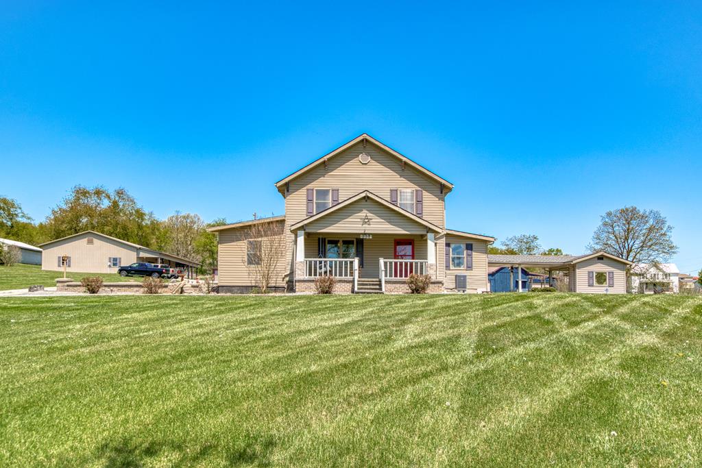 This 2 story farmhouse situated on 4.80 acres is your dream come true. Just freshened up with new paint throughout the house, newer bathroom tile, 2 newer heat pumps, new free standing gas logs, new light fixtures and fans, and new roof. This home and property is meticulously cared for and includes 7 buildings (all with electricity), mature landscaping. This home welcomes you with character and comfort inside and out with 4 bedrooms with master on the main floor with new walk in closet addition, 2 large bathrooms, country kitchen that includes all appliances, LOTS of storage, large family room, office/reading room, great basement/workout area, and 3, yes 3, porches to enjoy your own personal paradise. This is a very special home and property that is move in ready and waiting for a family to enjoy all it has to offer.