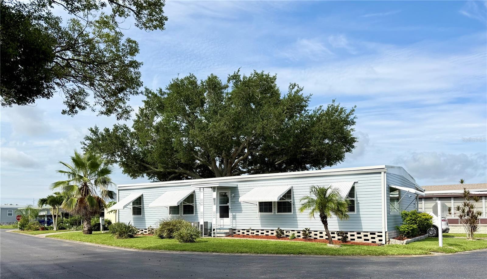 Welcome to this spacious upgraded 3-bedroom, 2-bath, 1,368 sq ft double-wide home. Located in Clearwater Cascade, one of Pinellas County’s premier 55+ resident-owned communities in Pinellas Park. Just minutes to the Gulf’s white-sand beaches and vibrant Downtown St. Petersburg, this home offers modern comfort, community amenities, and an unbeatable location.Recent upgrades in 2022 include a brand-new HVAC system and ductwork, electrical and plumbing updates, a $5,000 whole-house water filtration system, granite countertops with a granite kitchen island that is a spacious 6 x5 and room for barstools, large stainless-steel sink with modern faucet, garbage disposal, new stackable washer/dryer, and new refrigerator. Additional improvements include updated lighting fixtures, a stylish dining chandelier, sleek ceiling fan, 2" white blinds, windows have been updated as well as the sliding glass doors with built in blinds that lead out to your carport. Enjoy your exterior where well-placed landscaping has been added.You will not be bored in this community!Clearwater Cascade offers resort-style amenities including two pools, hot tub, saunas, racquetball, bocce ball, picnic area, fitness center, library, recreation hall, and a full calendar of activities. Conveniently located near beaches, shopping, dining, and easy access to nearby airports for traveling.Cash buyers only. 55+ resident-owned community. 1 pet is welcome.