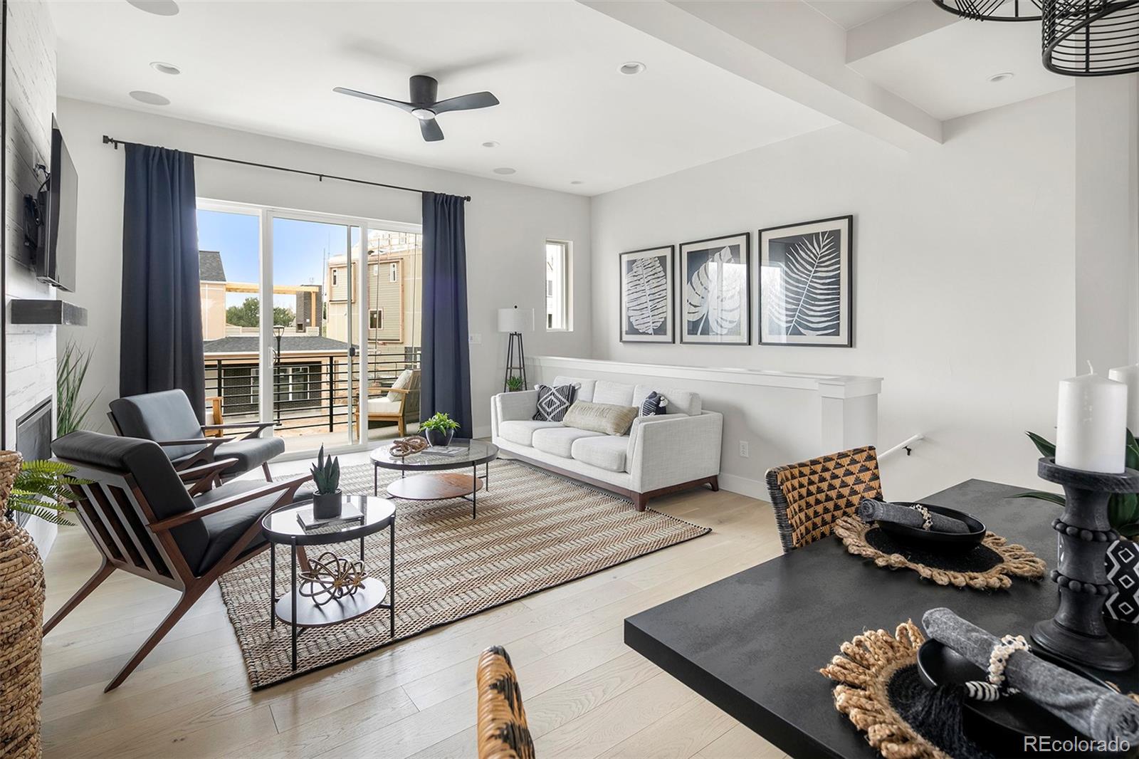 Welcome to this modern, urban-style end-unit townhome overlooking a beautifully landscaped courtyard in a secure, gated Denver community. Currently under construction, with the possible opportunity to personalize your finishes, this west-facing home offers access to a private lake, scenic trails, and neighborhood parks.The first level features a spacious coat closet, a mud area with built-ins, extra storage, a 2-car garage, and a versatile bedroom or office with an attached full bath. On the elevated second level, 10-foot ceilings create an open, airy feel. Enjoy a generous living room with a gas fireplace, a balcony perfect for grilling, a dedicated dining area, and a well-appointed kitchen with abundant cabinetry, a gas range, a picture window above the sink, and a walk-in pantry. A private powder room completes this floor.The third level hosts an expansive primary suite with a large walk-in closet and a beautifully finished bath featuring dual vanities, a shower with a bench, and an enclosed water closet. You’ll also find a conveniently located laundry closet for side-by-side machines, a third bedroom, a full bathroom, and a linen closet. Oversized windows throughout capture natural light and highlight the home’s contemporary finishes.Built by Colorado-based, family-owned Koelbel Communities, this home is located within Prelude at TAVA Waters—known for its private lake, mature trees, walking paths, and resort-style amenities including an outdoor pool and hot tub with lake views, and a state-of-the-art fitness center. Just steps from the High Line Canal and minutes from Lowry, Cherry Creek North, Anschutz Medical Center, downtown Denver, DTC, and DIA. Mortgage rate buy-down incentives available—ask how we can help lower your monthly payments. (Photos, video and virtual tour are of the model.)