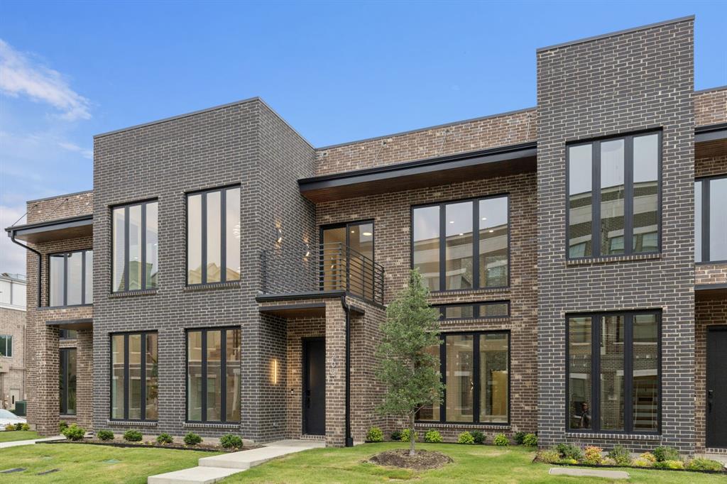 Live like you're in NYC or LA—right in the heart of Downtown Roanoke. This rare corner unit townhome exudes modern sophistication, style, and smart design. Soaring ceilings and walls of windows flood the space with natural light, creating a bright, open atmosphere that’s unmatched.
Designer details are everywhere—from the dramatic two-story fireplace and statement chandeliers to the sleek bar area with a wine and beverage fridge. The open-concept kitchen flows effortlessly into a private courtyard through oversized sliding glass doors, perfect for entertaining or relaxing in your own outdoor escape.
The first-floor primary suite offers a spa-inspired retreat with a luxe bath and oversized walk-in closet. Upstairs, two additional bedrooms, two full baths, half bath and a private balcony provide plenty of space for guests, a home office, or both.
This oversized corner unit also features a 2.5-car garage with extra room for a golf cart, storage, or hobby space, and it’s elevator-ready for future accessibility. Enjoy a true lock-and-leave lifestyle with HOA-maintained exterior and front yard.
Just steps from Roanoke’s top-rated restaurants, charming boutiques, and Rec Center—and minutes to Hwy 114, Southlake Town Square, and DFW Airport—this one-of-a-kind townhome perfectly blends urban edge with small-town charm. Photos are from a similar, previously completed unit to demonstrate potential finish-out and design features. Finishes may differ in current unit.