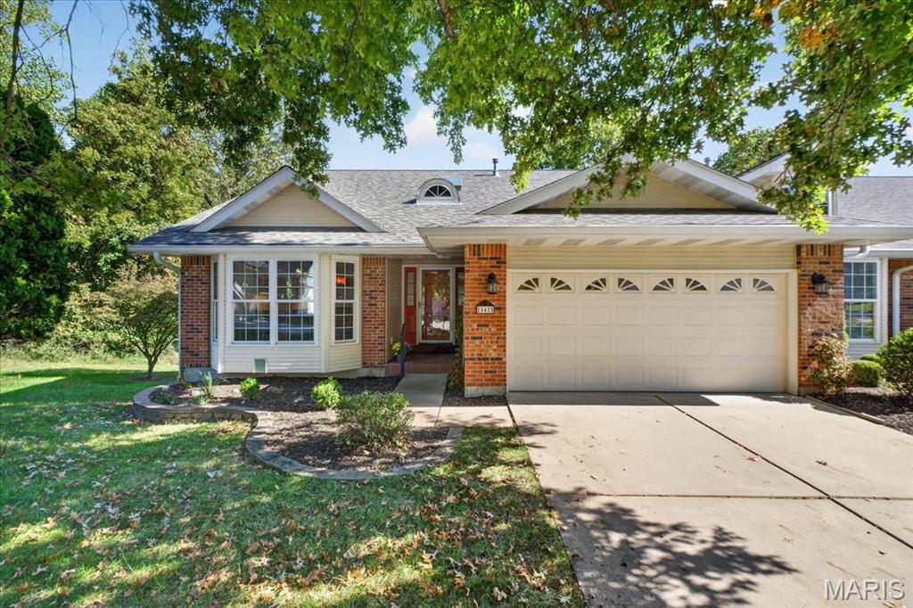 TURN-KEY 3 bedroom, 2.5 bath VILLA offering 2,594+/- sqft located in the highly desirable Chesterfield area! Solid wood flooring throughout most of main level. Covered front porch welcomes you as you step inside the entry foyer. Spacious living room boasts an expansive 10'+/- vaulted ceiling, gas fireplace, bay window & recessed lighting. Sunroom with laminate “wood like” flooring, 11’+/- vaulted ceiling & 3 walls of windows allowing plenty of natural light. UPDATED, kitchen offers custom 40” cabinetry, Quartz countertops, tile backsplash, center island w/breakfast bar, 14’+/- vaulted ceiling, stainless steel appliances, bay window & walk-in pantry. Primary suite features a tray ceiling, bay window, walk-in closet, slide closet & a BEAUTIFUL bath with a custom double sink vanity w/Granite, tile flooring, custom tile shower & freestanding tub. Dining room with a bay window & laundry room w/LVP “wood like” flooring completes main level. Walk-out lower level extends living quarters with a large family room w/carpet, recessed lighting, ventless fireplace, wall of windows & walk-out to patio. Rec room boasts laminate “wood like” flooring & wet bar. 2nd & 3rd Bedroom w/carpet, slide closets & shares hall full bath. Unfinished storage room for additional storage space. Outdoors, one will enjoy a level to sloping backyard with a tree line, covered concrete patio & 2-Car attached garage. Parkway School District w/easy access to Olive Blvd/RT-141/HWY 64, shopping, dining & Chesterfield amenities. MUST SEE!