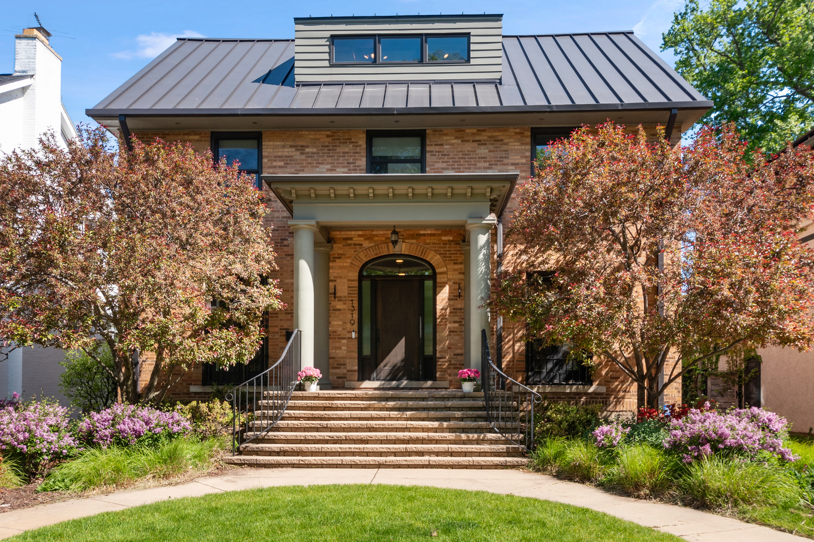 The possibilities are endless in this truly exceptional Evanston residence where timeless architecture meets sophisticated modern living. Located across from the newly renovated Canal Shores golf course, and just moments from the lakefront, this expansive brick Colonial offers a rare combination of elegance, flexibility, and scale - including a beautifully updated private guest house ideal for extended family, guests, or a luxe work-from-home retreat. A gracious center-entry foyer filled with natural light, soaring ceilings, and refined contemporary finishes welcome you into the home. The main level features a handsome office or den, an oversized dining room with a dramatic fireplace, and stunning open-concept eat-in kitchen with family room, and separate mud-room with easy access to the oversize 2-car attached garage, backyard and patio. Upstairs are four spacious bedrooms and three updated baths, including a serene primary suite with vaulted ceilings, a walk-in closet, and a spa-inspired bath. The third floor offers expansive flexible space perfect for a playroom, media room, office, or teen retreat with beautiful golf course views. Connected through the mudroom, the private guest residence or in-law suite, is a standout feature rarely found in Evanston, complete with its own designer kitchen, laundry, living space, full bathroom and sun-filled bedroom. The lower level offers even more versatility with space for whatever you need - a recreation room, a gym area, movie room, or playroom, complete with additional extensive storage. Perfectly positioned near Central Street's beloved restaurants, coffee shops, boutiques, Metra, CTA trains, parks, Lighthouse Beach, this one-of-a-kind home offers an unmatched lifestyle in one of Evanston's most sought-after neighborhoods. This is truly a home designed to grow with every stage of life.