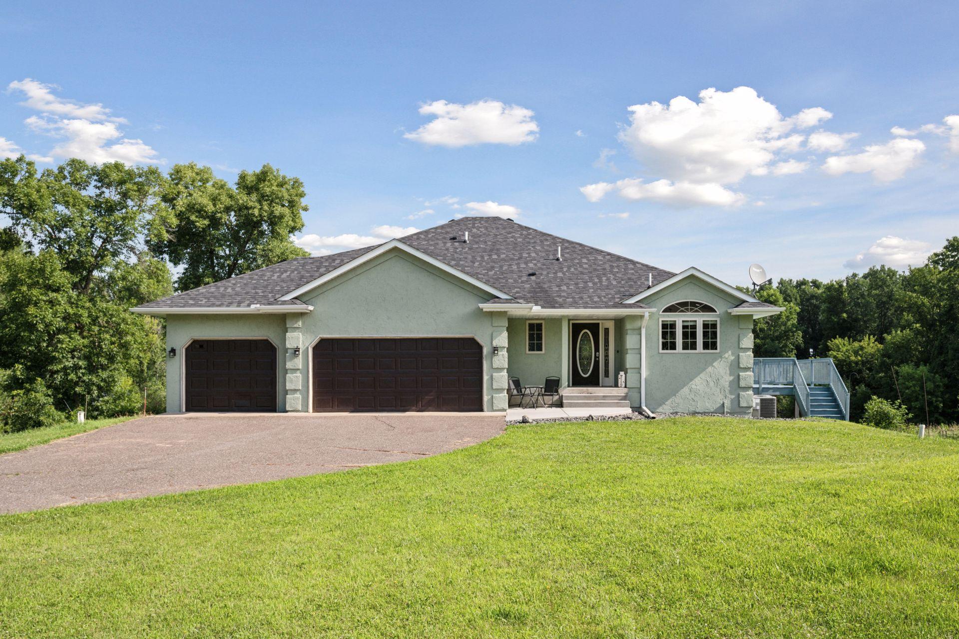 Have your own dock on the lot or share one down the road! Nestled on Rush Lake with a pond. Home is on 1 acre of the 7.56 acres and is above the high water line. Another acre along the gravel road currently has a large deer stand. Have a private dock on the lot, or use the private no-association shared access on lot 1 block 3 along with the private swimming beach area on lot 2 block 3. This stunning 3 bedroom, 3 bathroom residence offers an exceptional lakeside living experience in Rush City and Nessel Township, MN. Built in 2001, this spacious home boasts 1,444 sq ft above ground finished living space, and a total of 2,816 sq ft of finished space, including a walkout basement with additional finished living area. Updated mechanicals and newer roof too!

Lot qualifies to have an ADU added if you like!

Step inside to discover a thoughtfully designed interior featuring hardwood floors, vaulted ceilings, and natural woodwork throughout. The main level offers a welcoming foyer, a spacious kitchen with a breakfast bar and window, a comfortable vaulted ceiling living room with gas fireplace, and an informal dining room with deck access. A convenient half bath is also located on this level between the front entry and the garage access.

The upper level features two bedrooms, including a primary suite with a walk-in closet and a full walk-through ensuite bathroom with a walk-in shower and separate tub. An additional bedroom on this level provides ample space for guests.

The lower two levels provided even more living space both with walkout sliding doors. Including a family room, a third bedroom/office, a laundry room with sink with gas dryer, and an entertainment room with bar plumbed for sink, and two utility rooms round out these two levels. 

Enjoy outdoor living on the spacious 35x13 deck and look out to the water.  You can have one dock on the property and one on Lot 1 Block 2 which is on the left as you drive onto the "island". This is shared with the 19 lot owners on the north side of Belle Isle Dr. There is one dock installed and spot to place a 2nd, along with access to the swimming beach along this dock lot. See map. Offering direct access to fishing, boating, and other water activities. 

Additional features include a 3-car attached, insulated, heated garage with garage door opener, central air conditioning, a gas fireplace, and a security system. The property is served by a private well and a septic system (tank with drainage field).

Located in School District 139, this home offers a tranquil retreat with convenient access to amenities. With its expansive lot, lake access, and numerous features, this property is ideal for those seeking a primary residence year round or a seasonal escape. Dock up to restaurants on the lake!