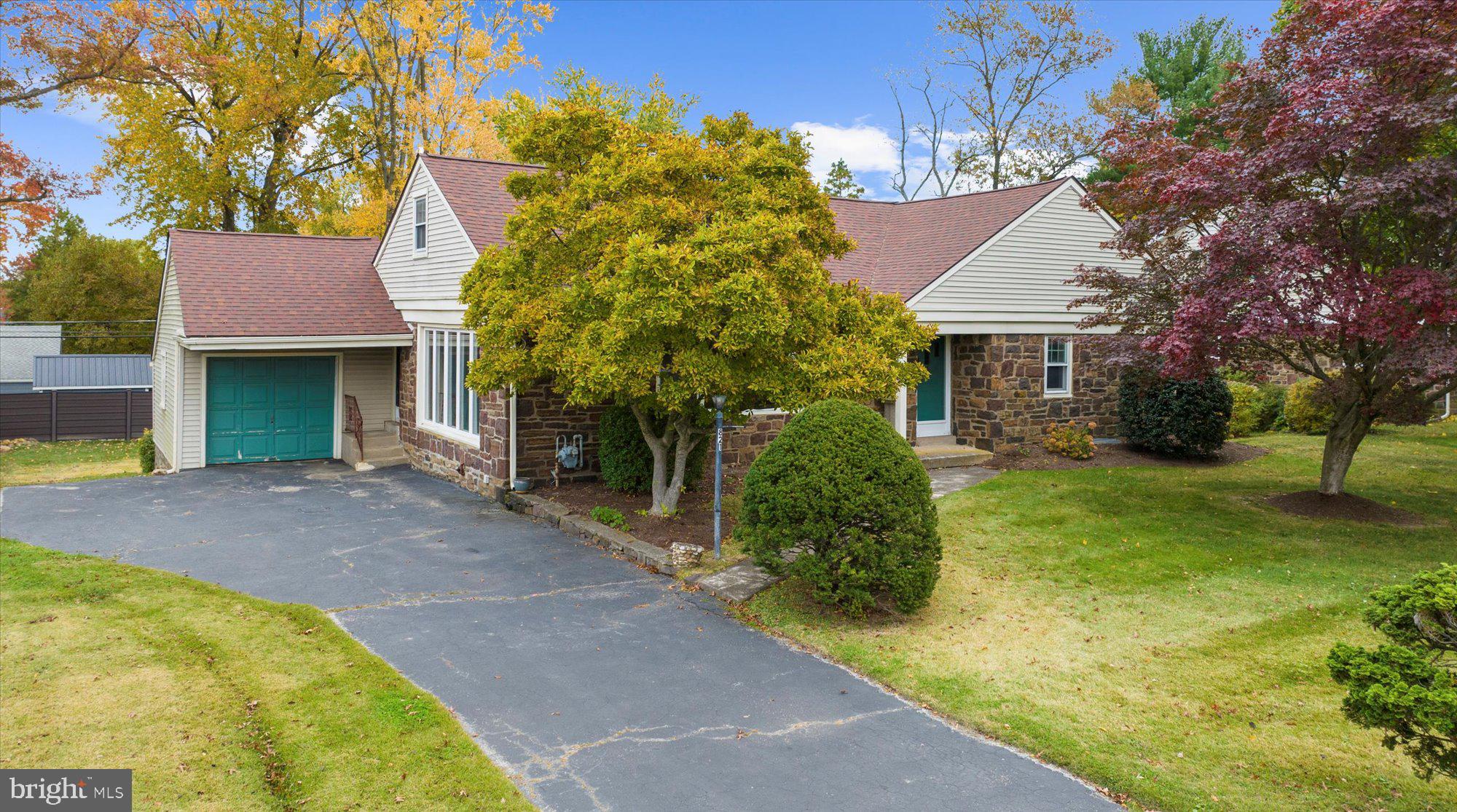 Welcome home to this charming Cape Cod-style residence filled with character and natural warmth. From the timeless stone exterior to the mature trees that frame the property, this home immediately draws you in with its classic curb appeal. Step inside to a bright and welcoming family room featuring rich hardwood floors, a stunning wood-paneled accent wall with built-in shelving, and a cozy fireplace that serves as the heart of the home. Expansive windows fill the space with natural light, creating a warm and inviting atmosphere perfect for relaxing or entertaining. Just around the corner, the kitchen and dining area offer an open and functional layout ideal for everyday living. The kitchen includes wood cabinetry, updated stainless steel appliances, a double-sided sink, and ample counter and cabinet space. The adjoining dining area is bright and spacious, perfect for gatherings and celebrations, especially with the holidays approaching. The first floor also includes a convenient half bath for guests, along with two comfortable bedrooms featuring generous closet space and a full hall bath. Upstairs, you’ll find two additional bedrooms and another full bathroom, offering plenty of flexibility for family, guests, or a home office. The lower level provides the best of both worlds with a finished area ideal for entertaining or a cozy recreation space, plus ample storage for seasonal décor, tools, and equipment. Additional storage space can be used in the attic. An attached one-car garage offers added convenience and keeps your car protected from the elements. Outside, the backyard offers an expansive two-tiered deck, and a stone patio. There is plenty of space to entertain! The property is also conveniently located. Nearby, you will find Coopertown Elementary school, Haverford College, Bryn Mawr Hospital, Merion Golf Club, Freedom Playground, Highland Farm Park and so many shops, restaurants and stores to explore! This home perfectly blends classic charm, comfortable living, and everyday functionality—ready for you to make it your own.